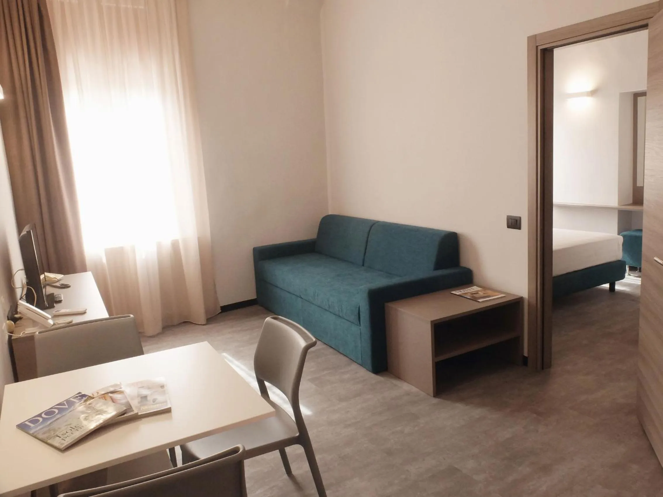 Living room, Bed in Residence Carlton