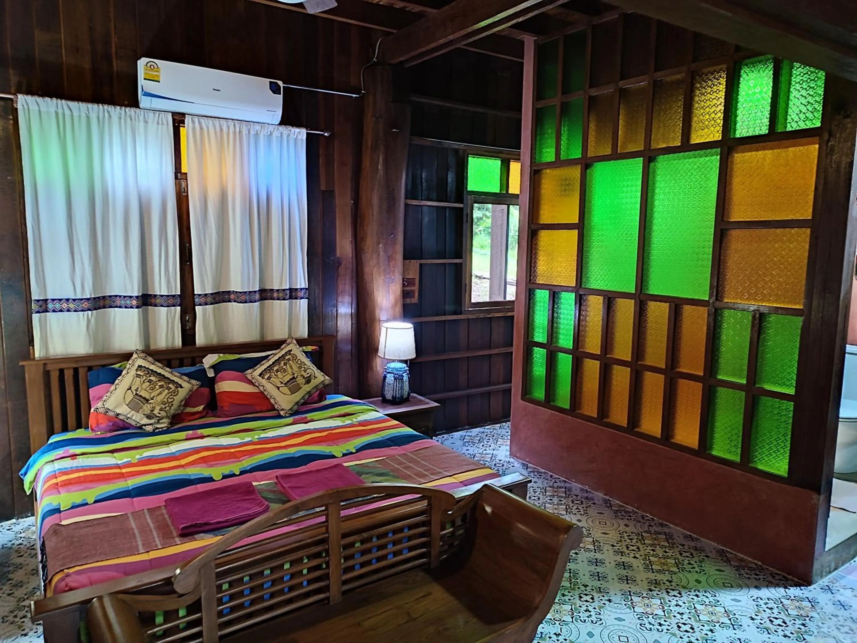 Bed in Nan De Panna Resort and Spa