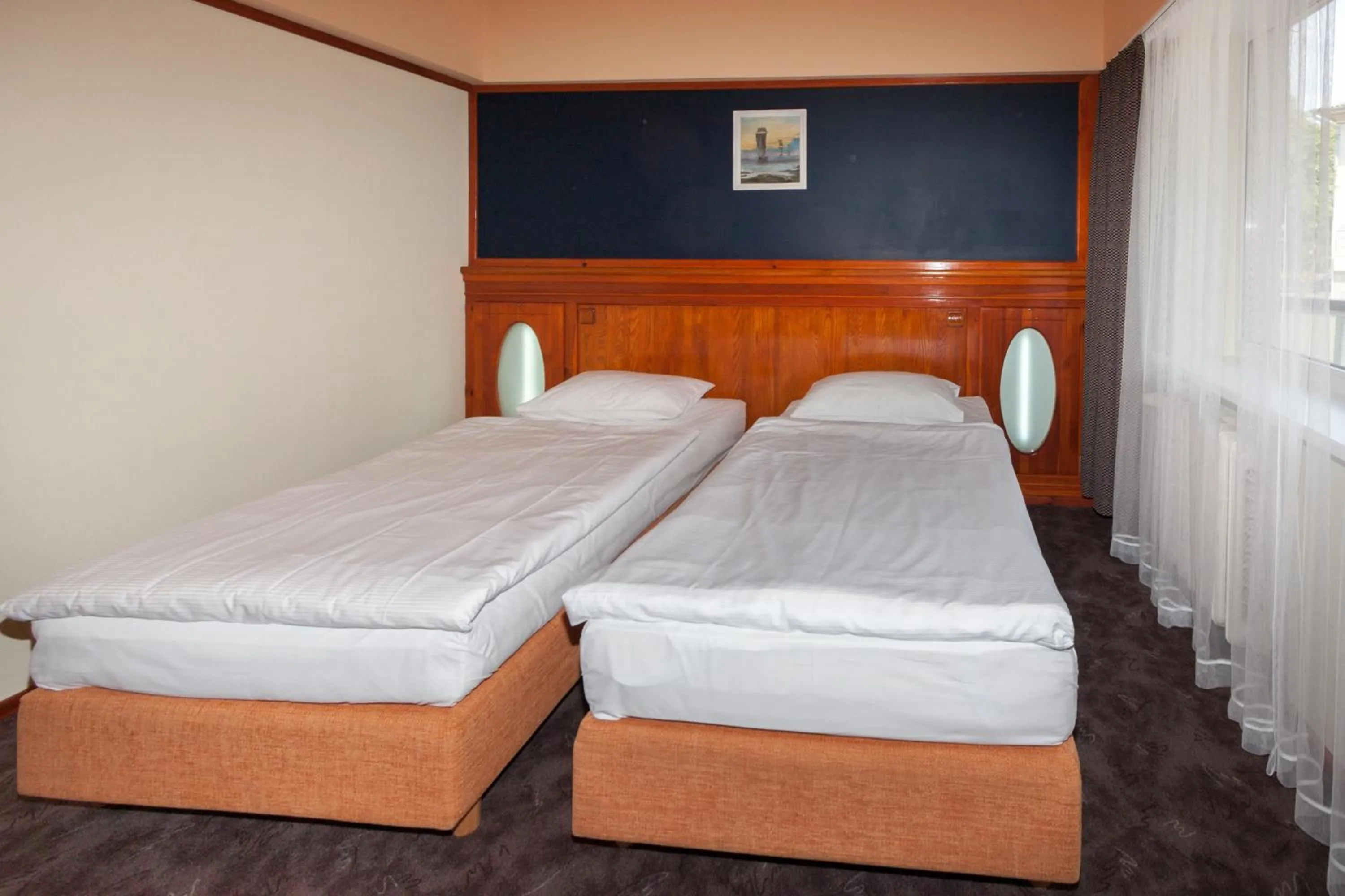Bed in Tauras Center Hotel
