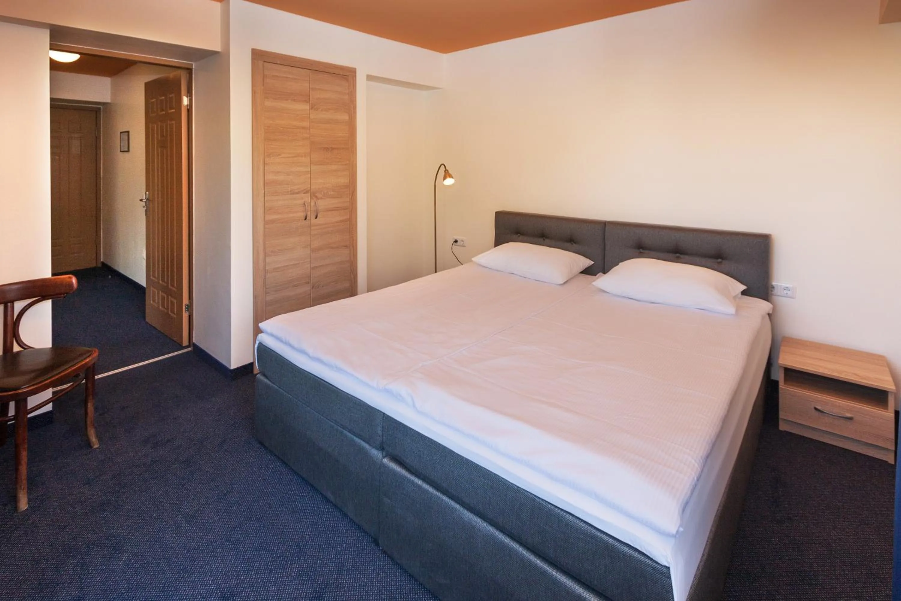 Bed in Tauras Center Hotel