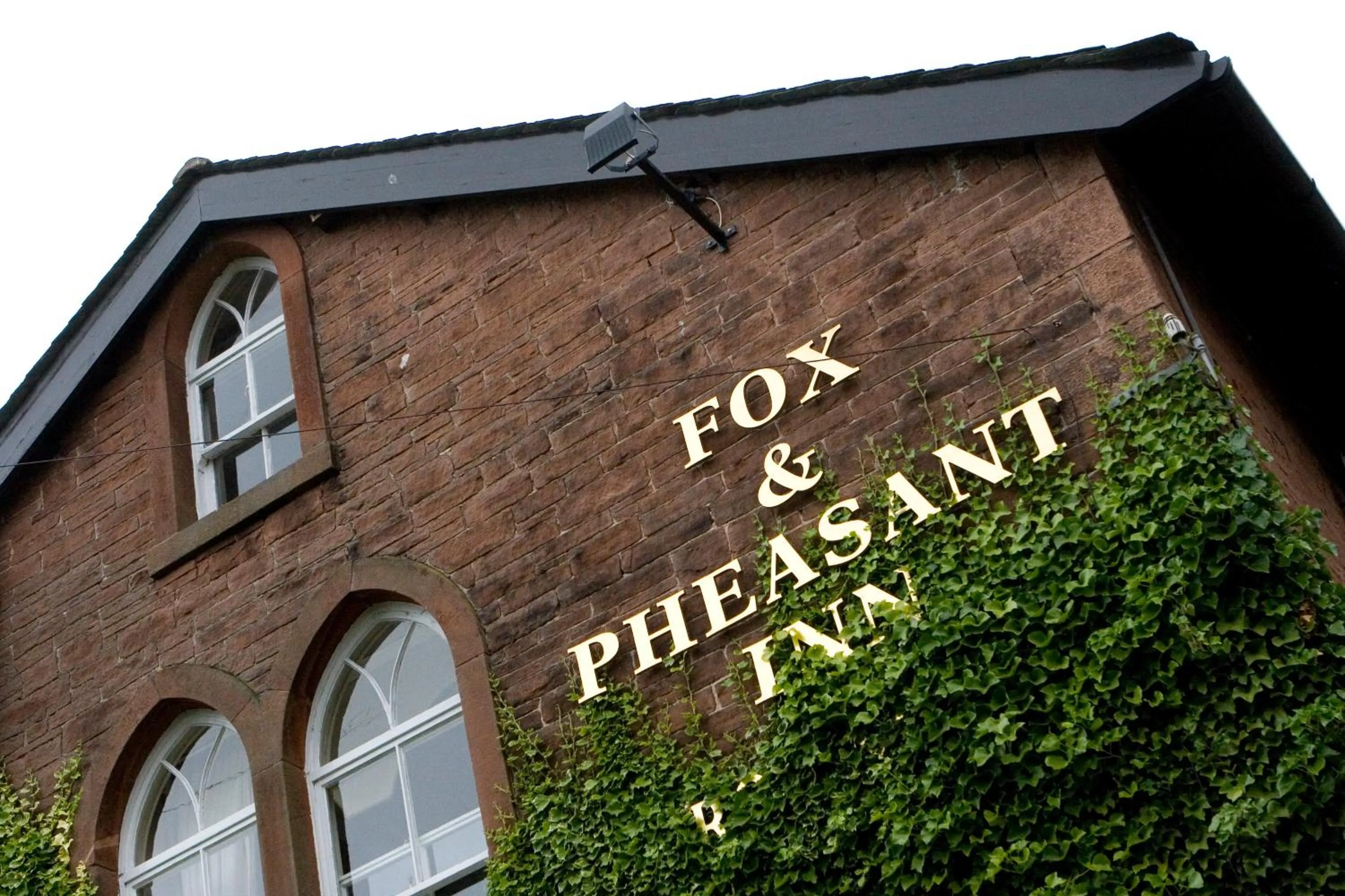 Property logo or sign in Fox and Pheasant Inn