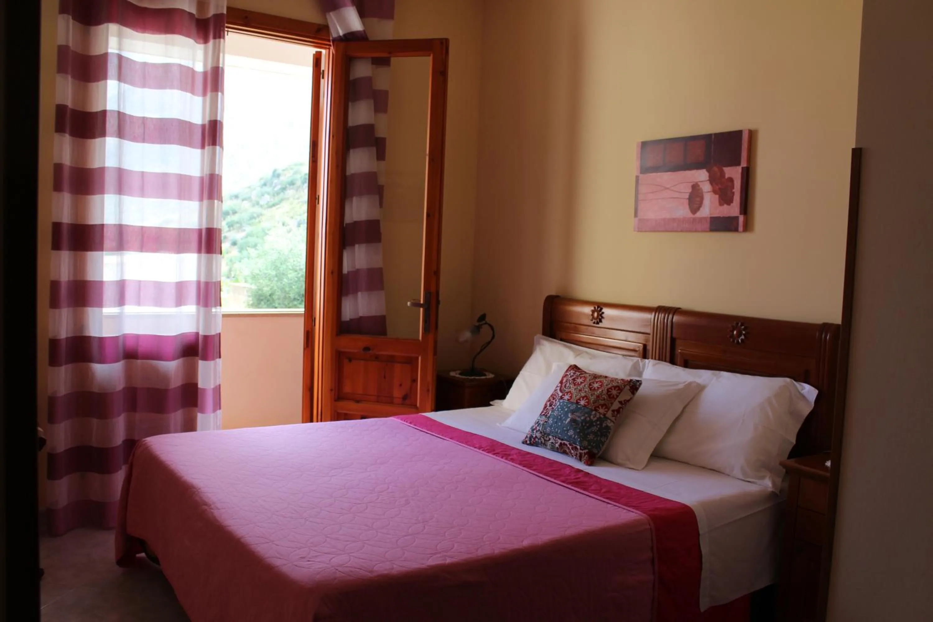 Bed in Raggio di Sole Bed & Breakfast