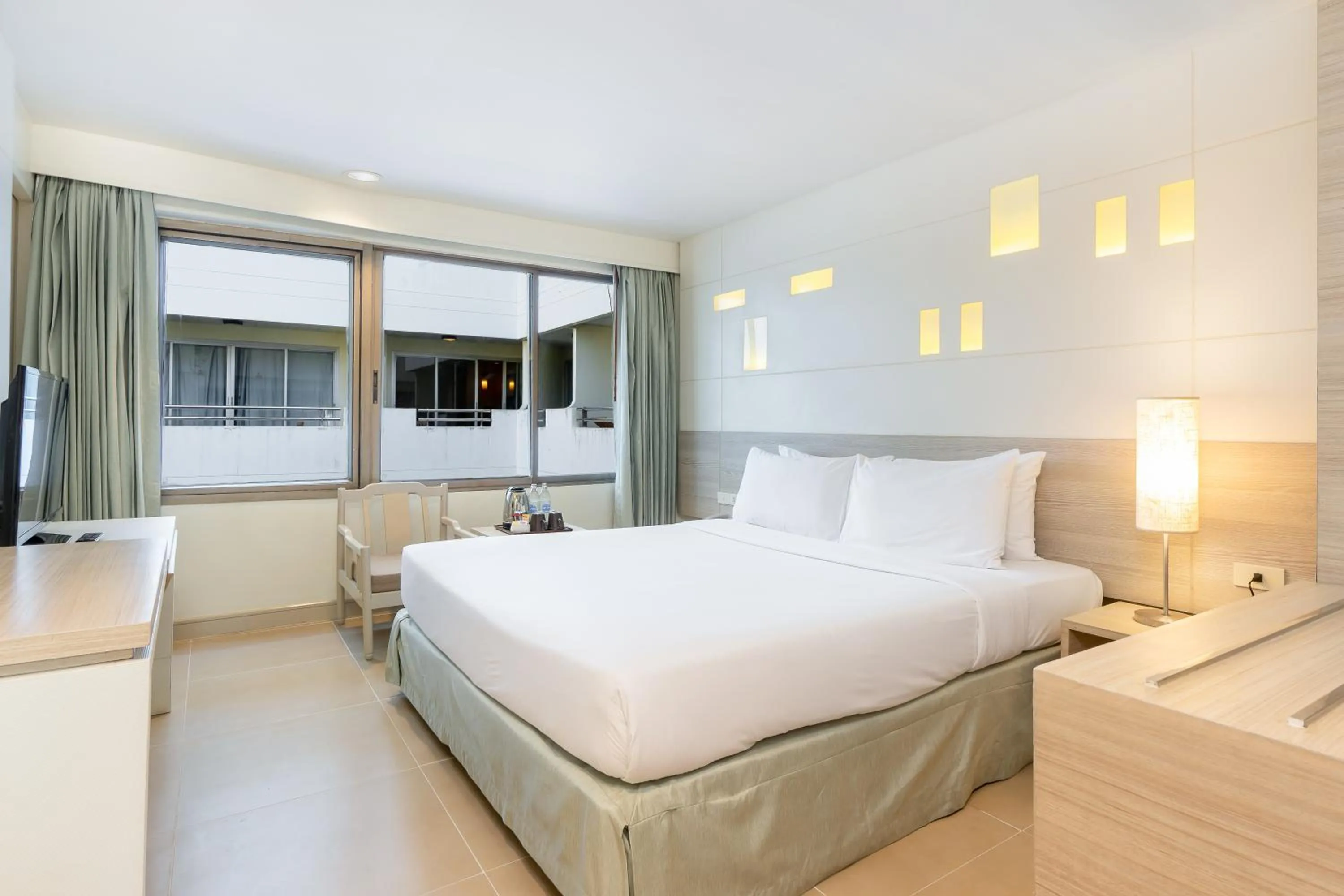 Bed in Sunshine Hotel & Residences
