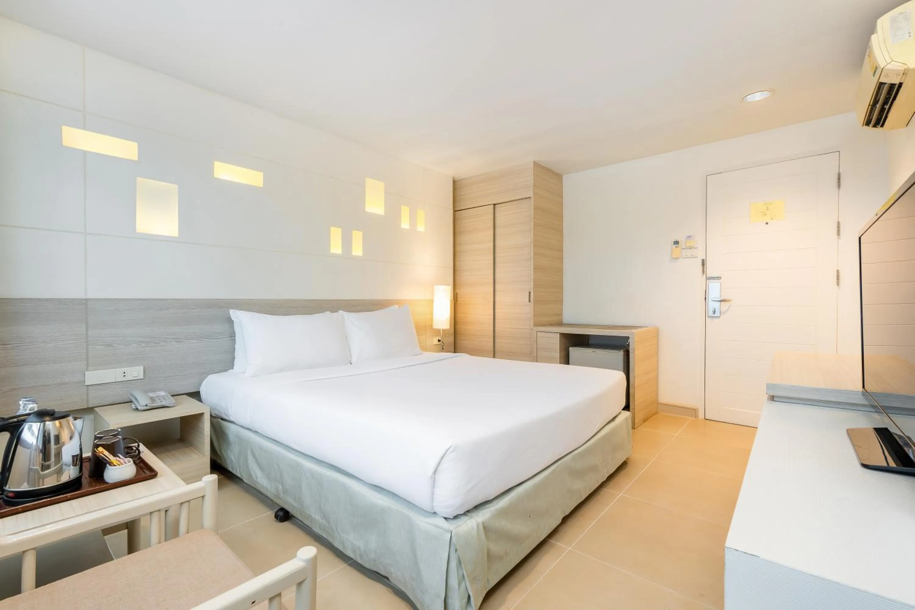 Bed in Sunshine Hotel & Residences