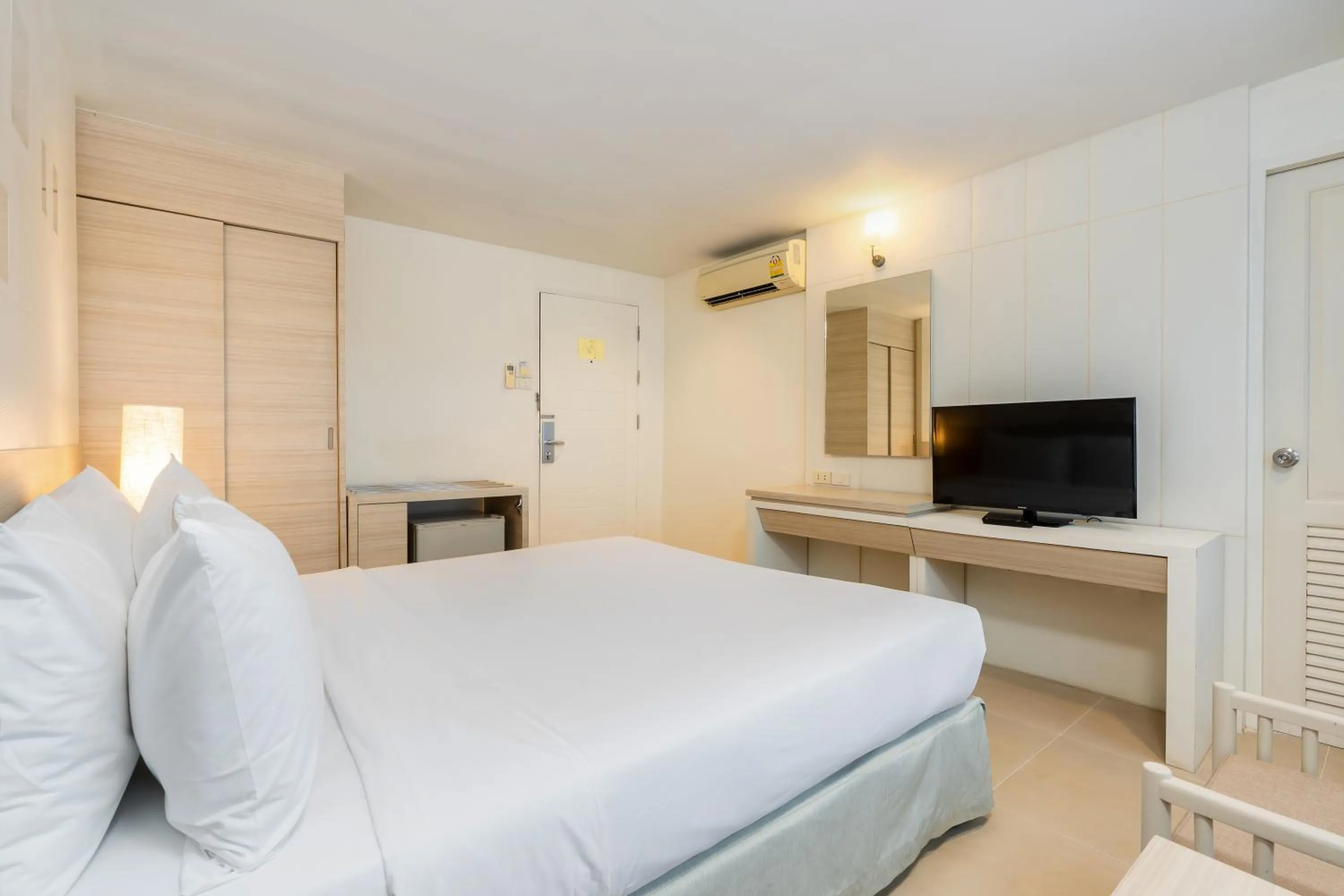 Bed in Sunshine Hotel & Residences