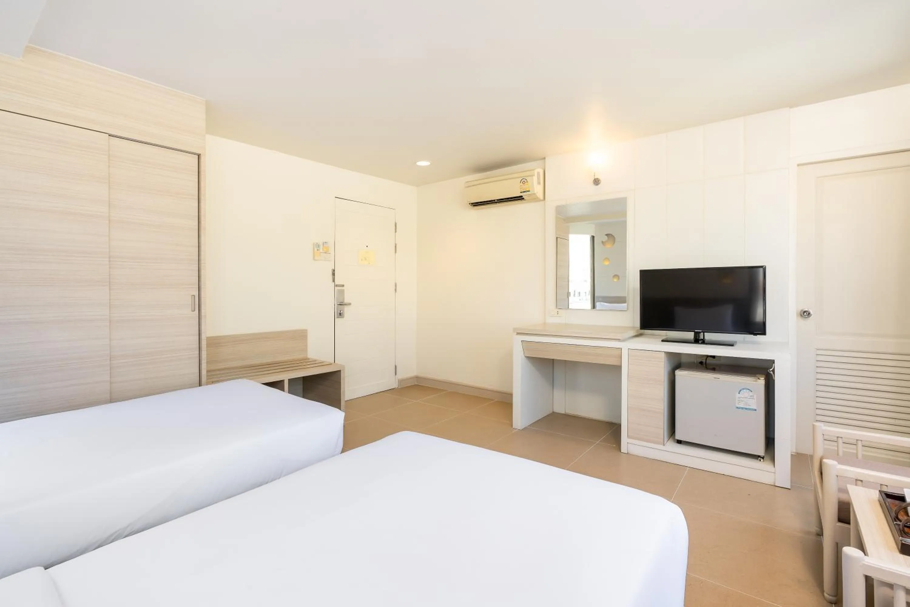 Bed in Sunshine Hotel & Residences