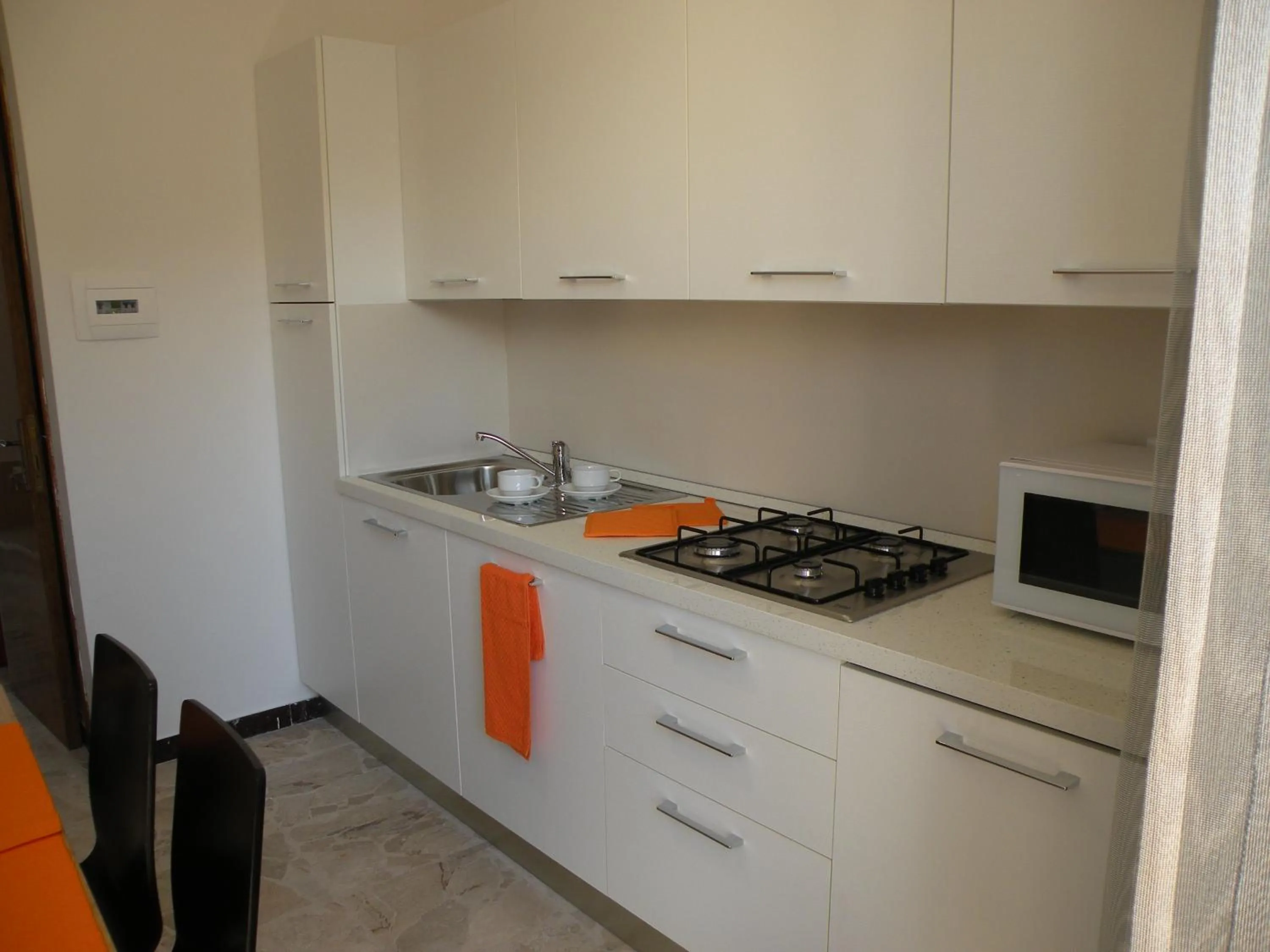 Kitchen or kitchenette in La Casa sul Corso B&B