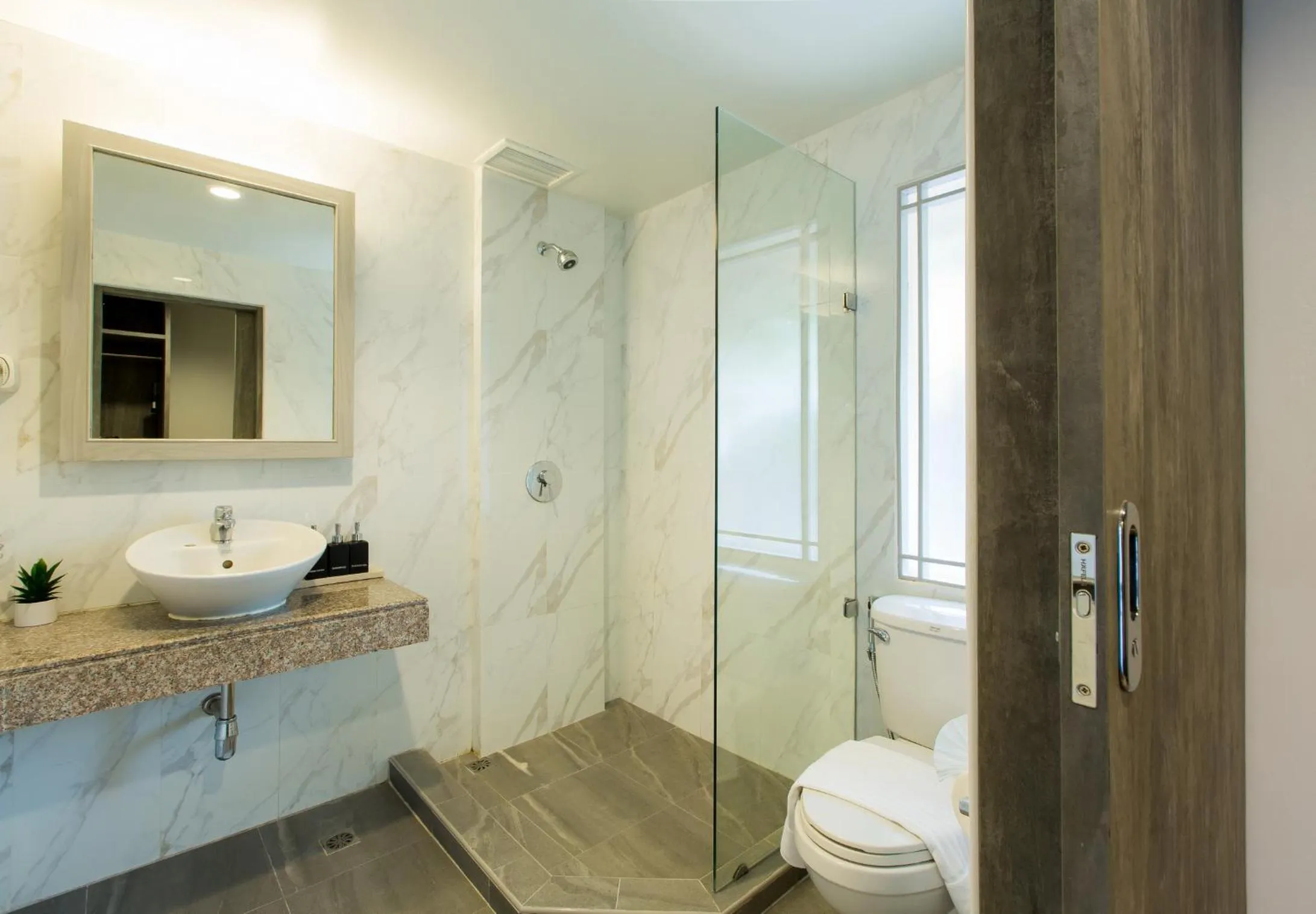 Shower in Coconut Village Resort Phuket - SHA Extra Plus