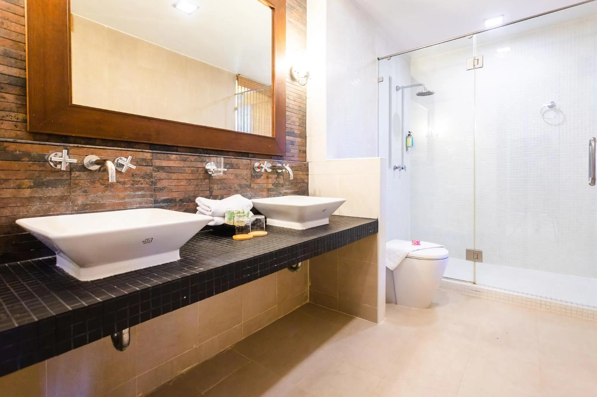 Bathroom in Coconut Village Resort Phuket - SHA Extra Plus