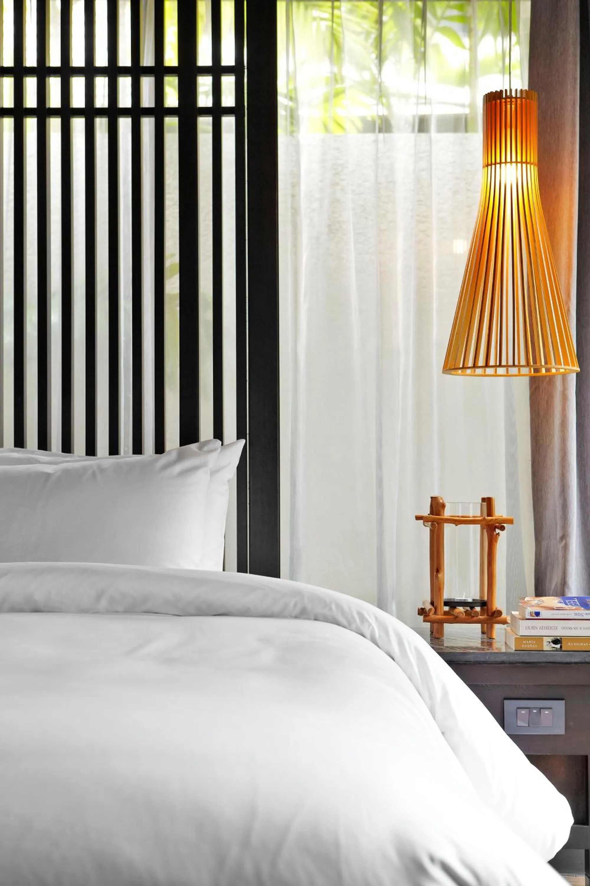 Bed in Sareeraya Villas & Suites