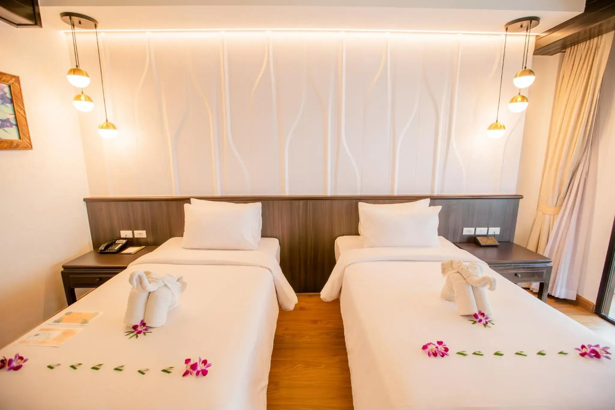 Deluxe Double or Twin Room with Pool View in Nipa Resort, Patong Beach Deluxe Double or Twin Room with Pool View in Nipa Resort, Patong Beach