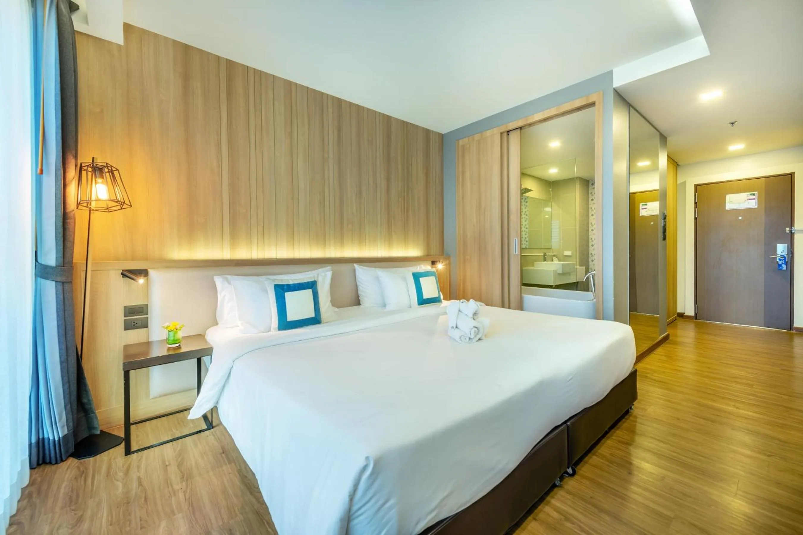 Bed in PLAAI Prime Hotel Rayong SHA Extra Plus