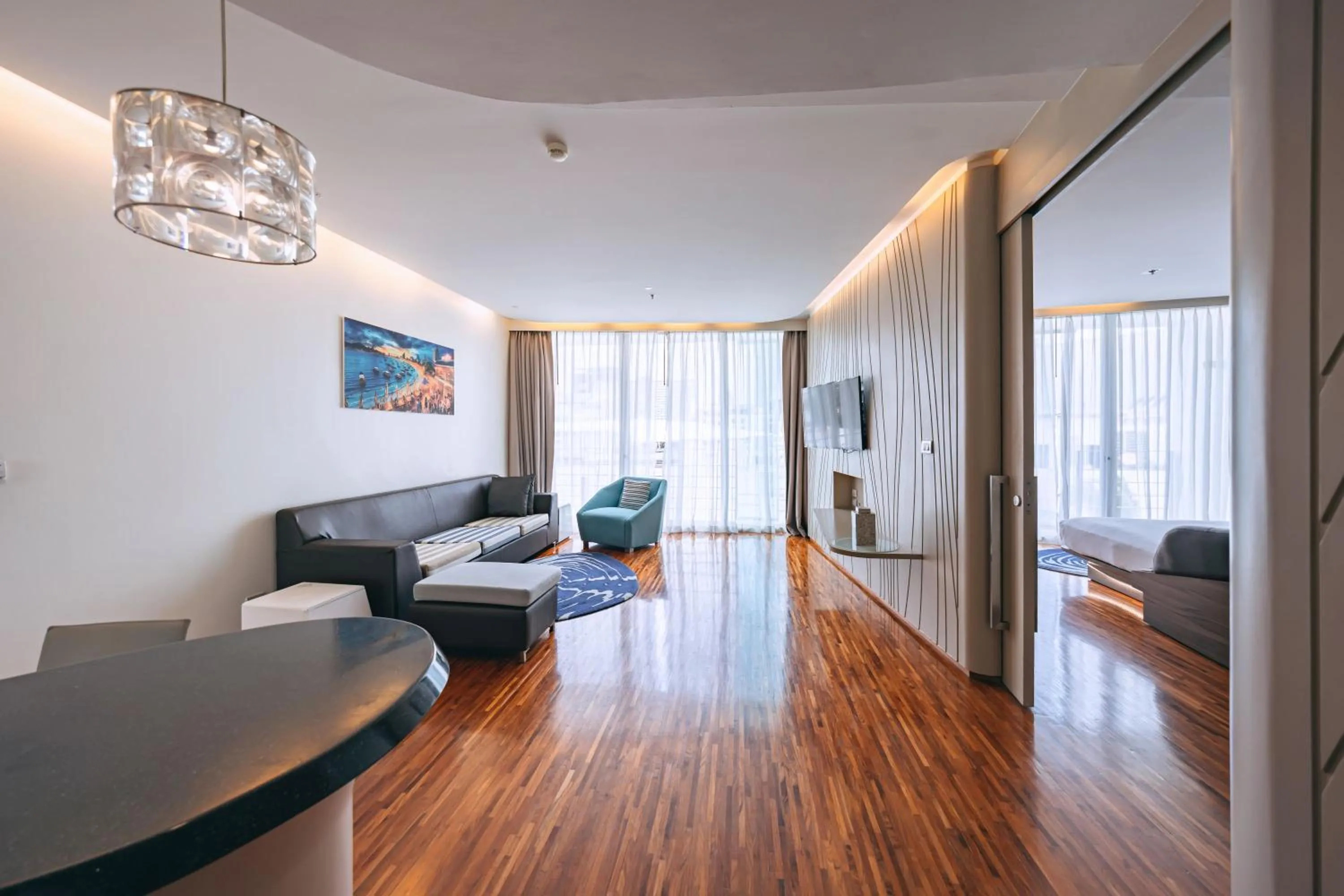 Living room in Hotel Baraquda Heeton Pattaya by Compass Hospitality