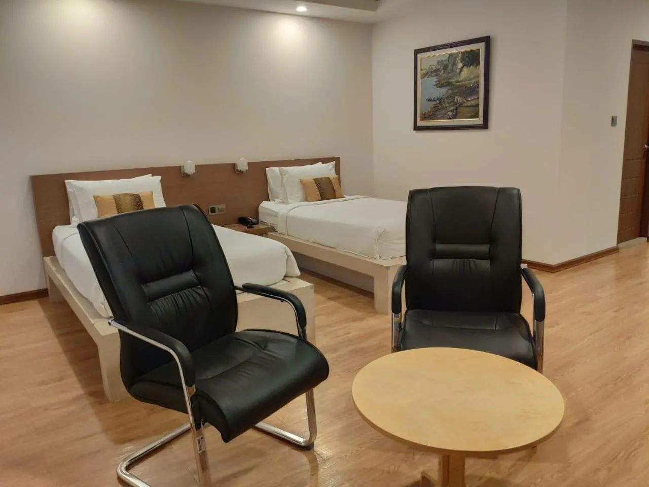 Seating area, Bed in Serene Valley Hotel