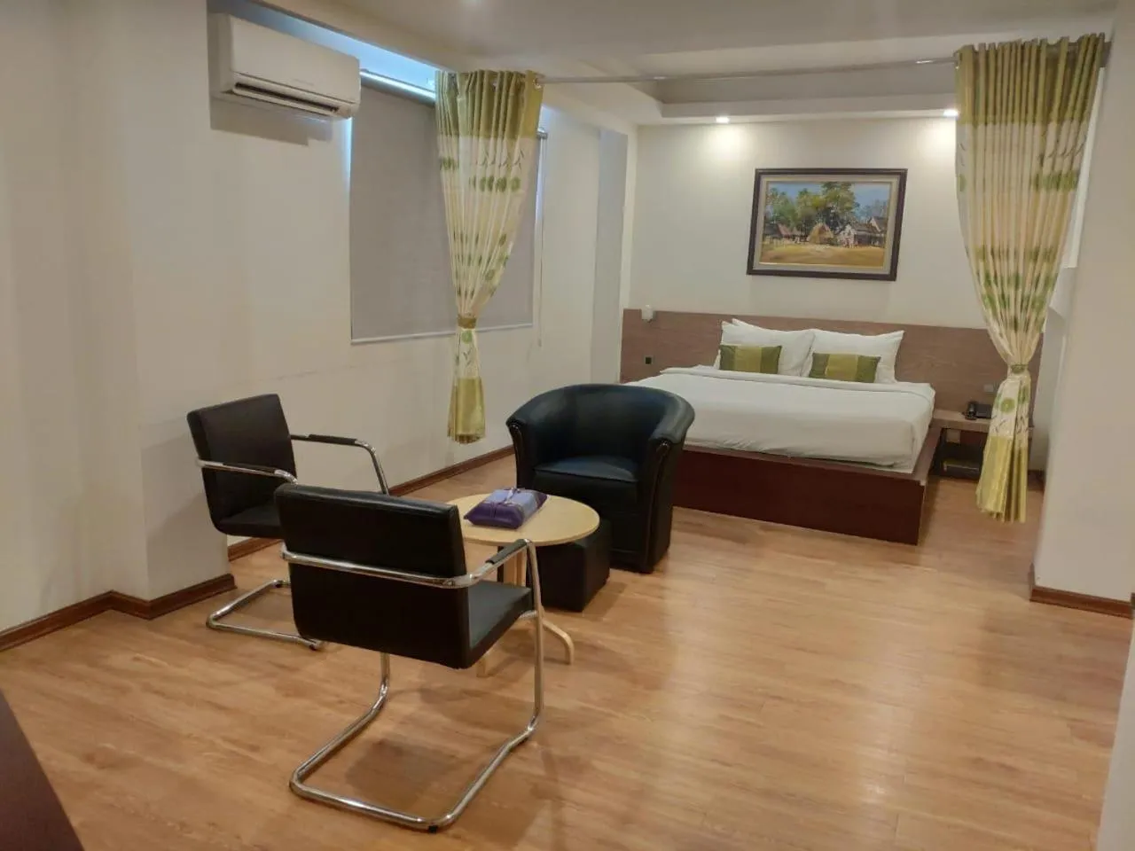 Seating area, Bed in Serene Valley Hotel