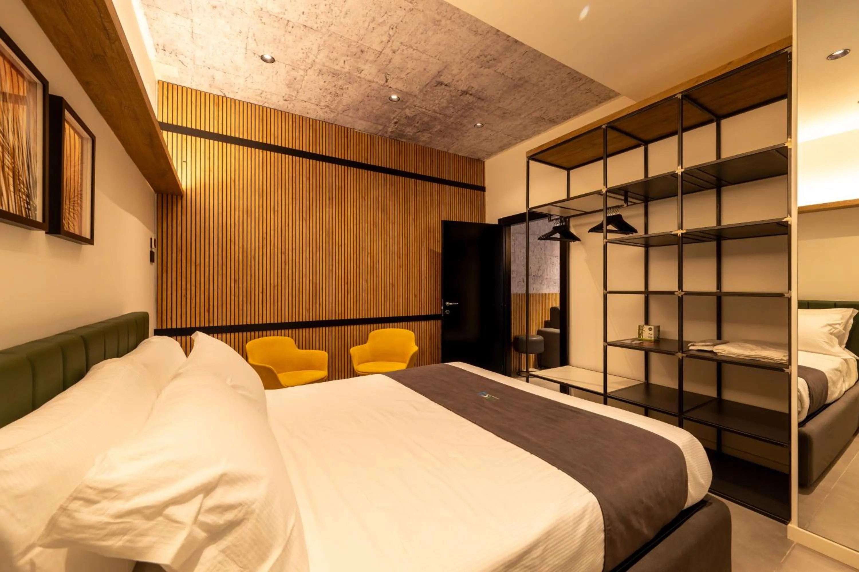 Bed in Meg Lifestyle Hotel & Apartaments