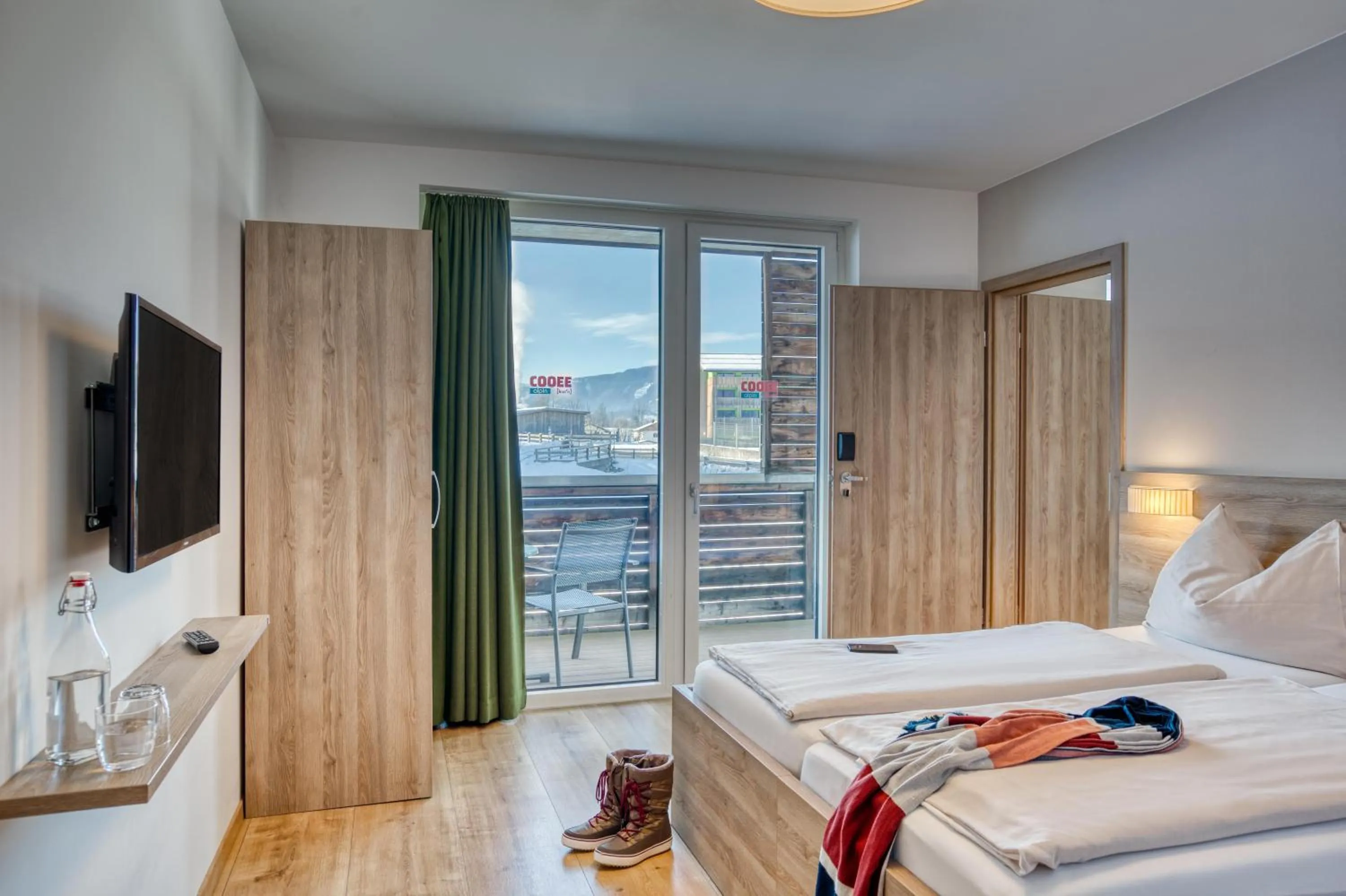 TV and multimedia, Bed in COOEE alpin Hotel Kitzbüheler Alpen