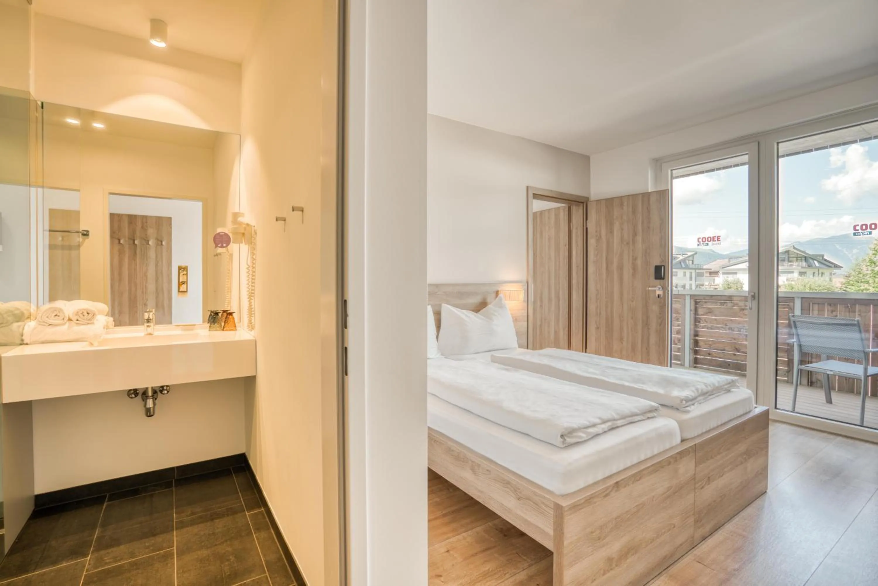 Photo of the whole room, Bed in COOEE alpin Hotel Kitzbüheler Alpen