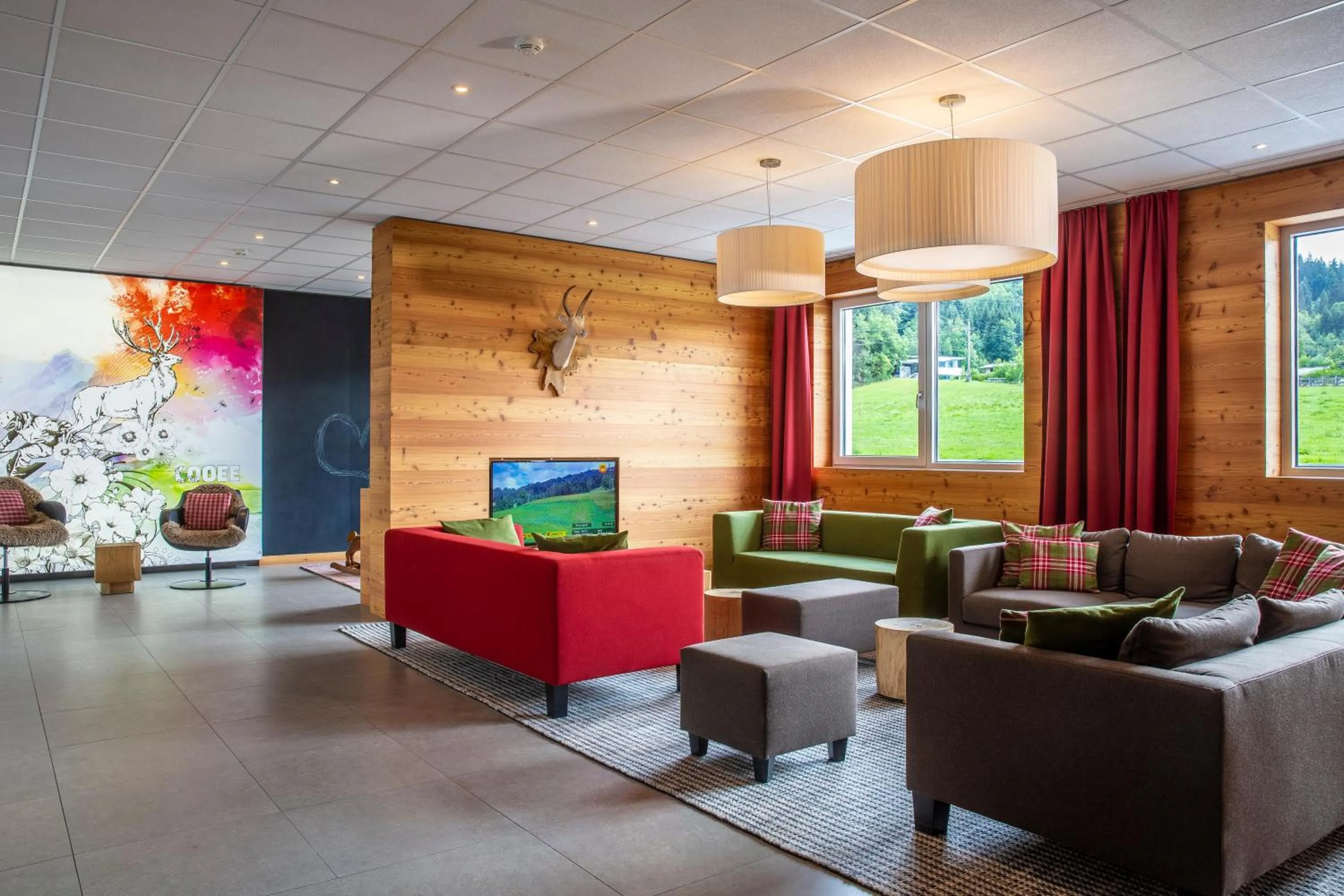 Lobby or reception in COOEE alpin Hotel Kitzbüheler Alpen