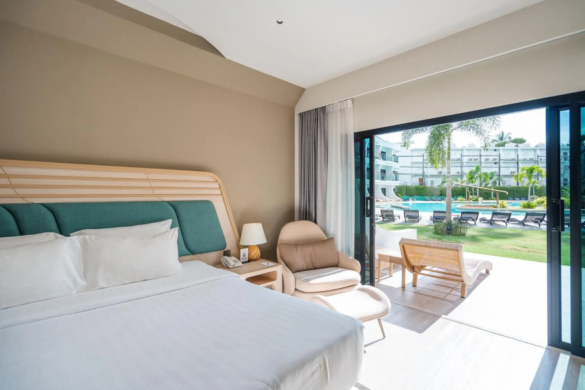 Pool view, Bed in Amora Beach Resort Phuket