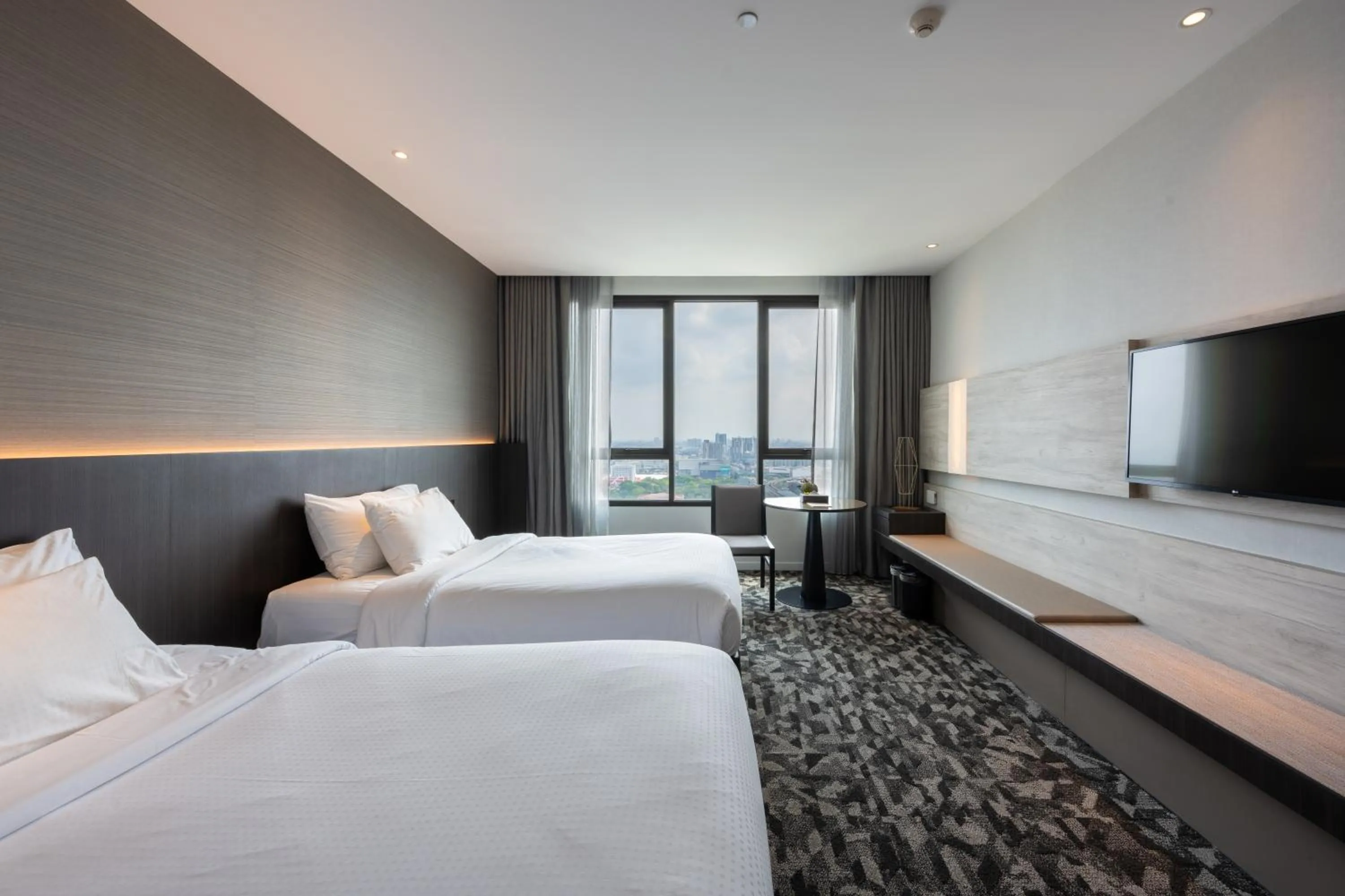 Bed in Grand Richmond Stylish Convention Hotel