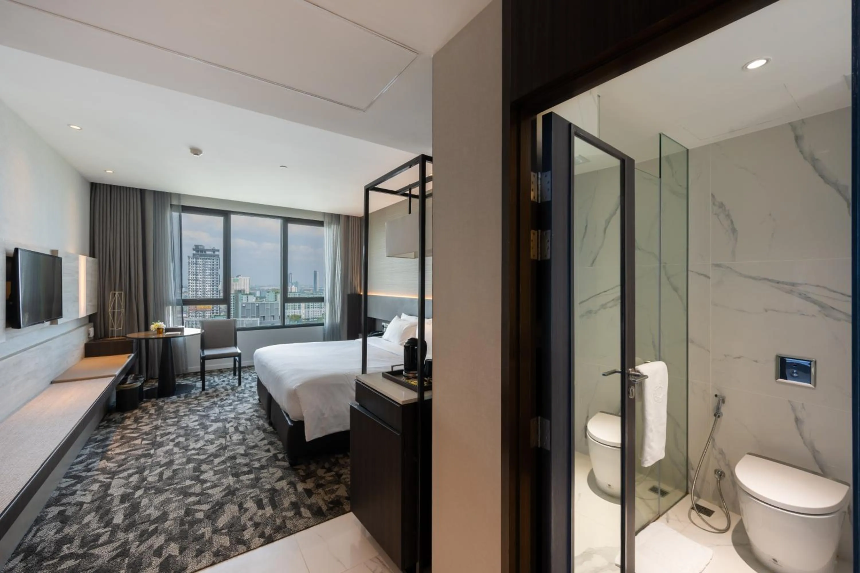 Bed in Grand Richmond Stylish Convention Hotel