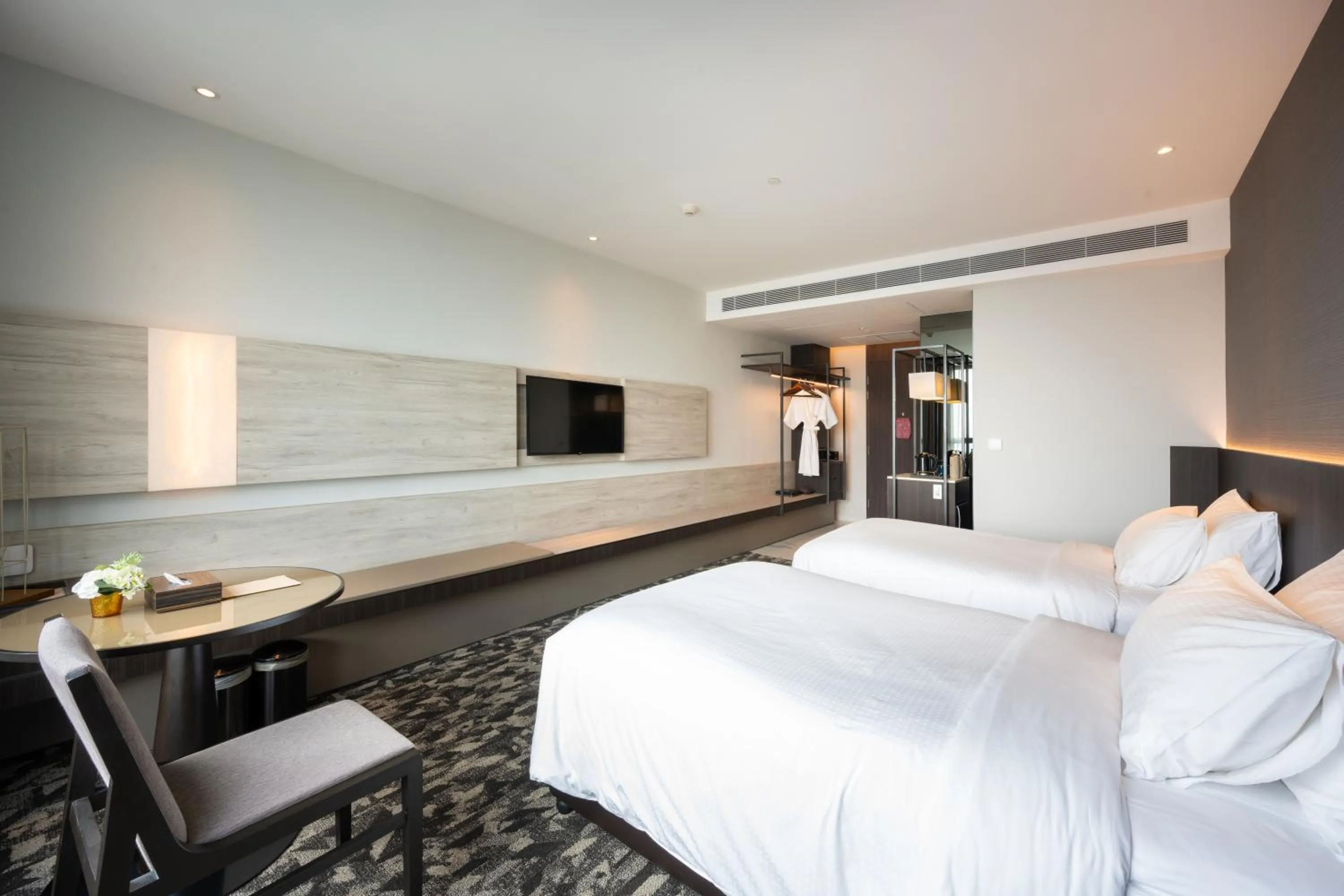 Bed in Grand Richmond Stylish Convention Hotel