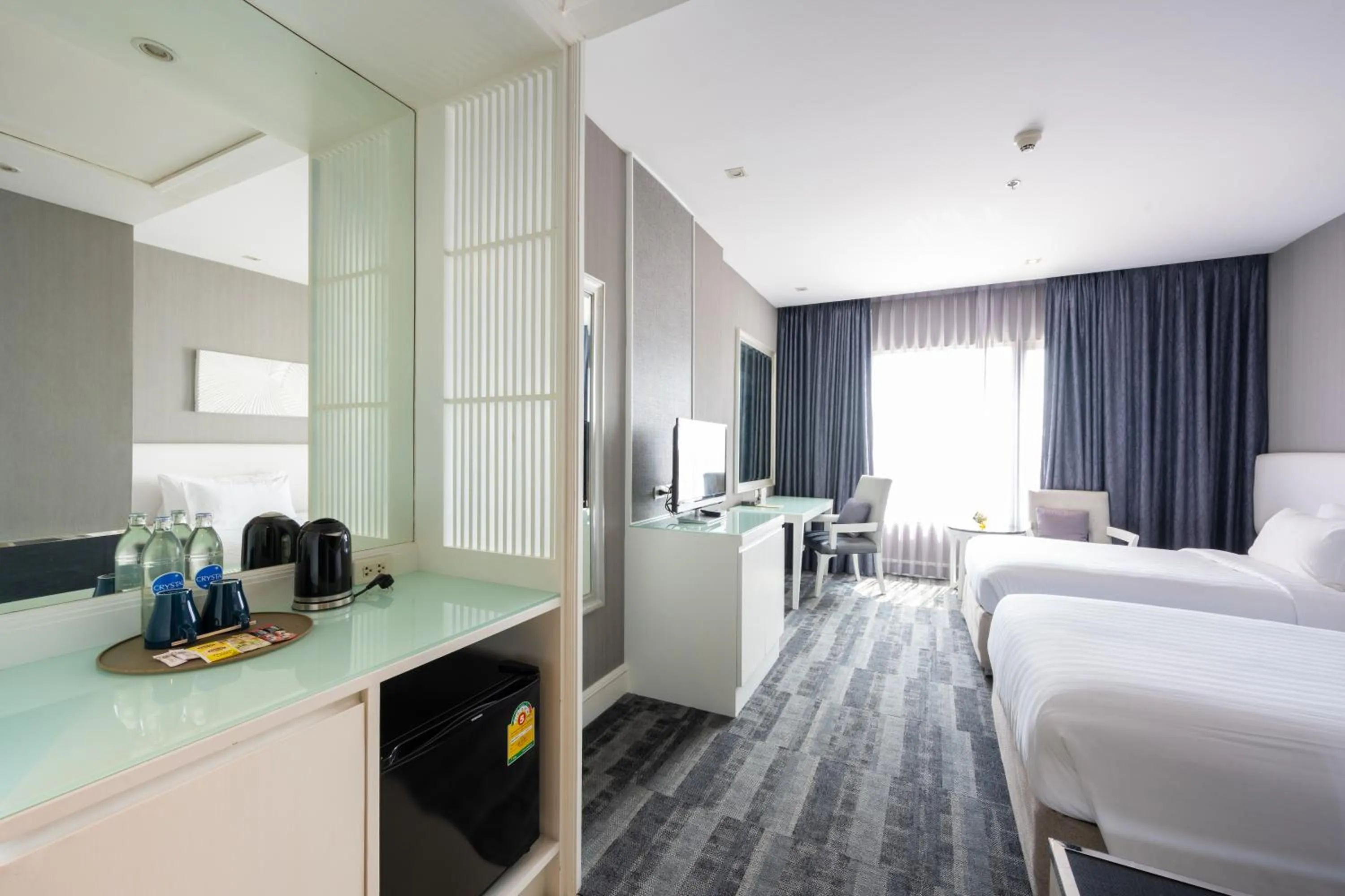 Bed in Grand Richmond Stylish Convention Hotel