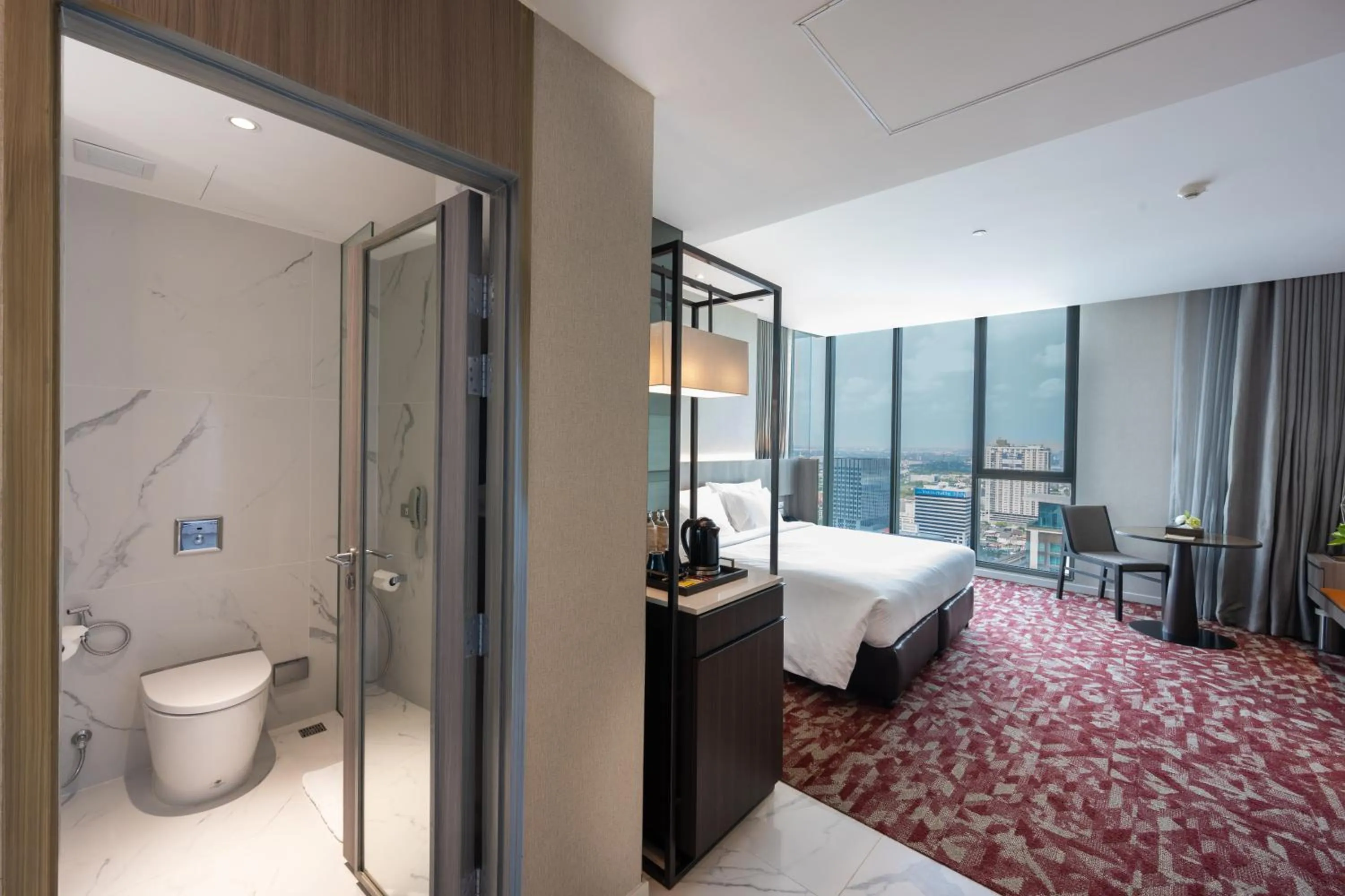 Bed in Grand Richmond Stylish Convention Hotel