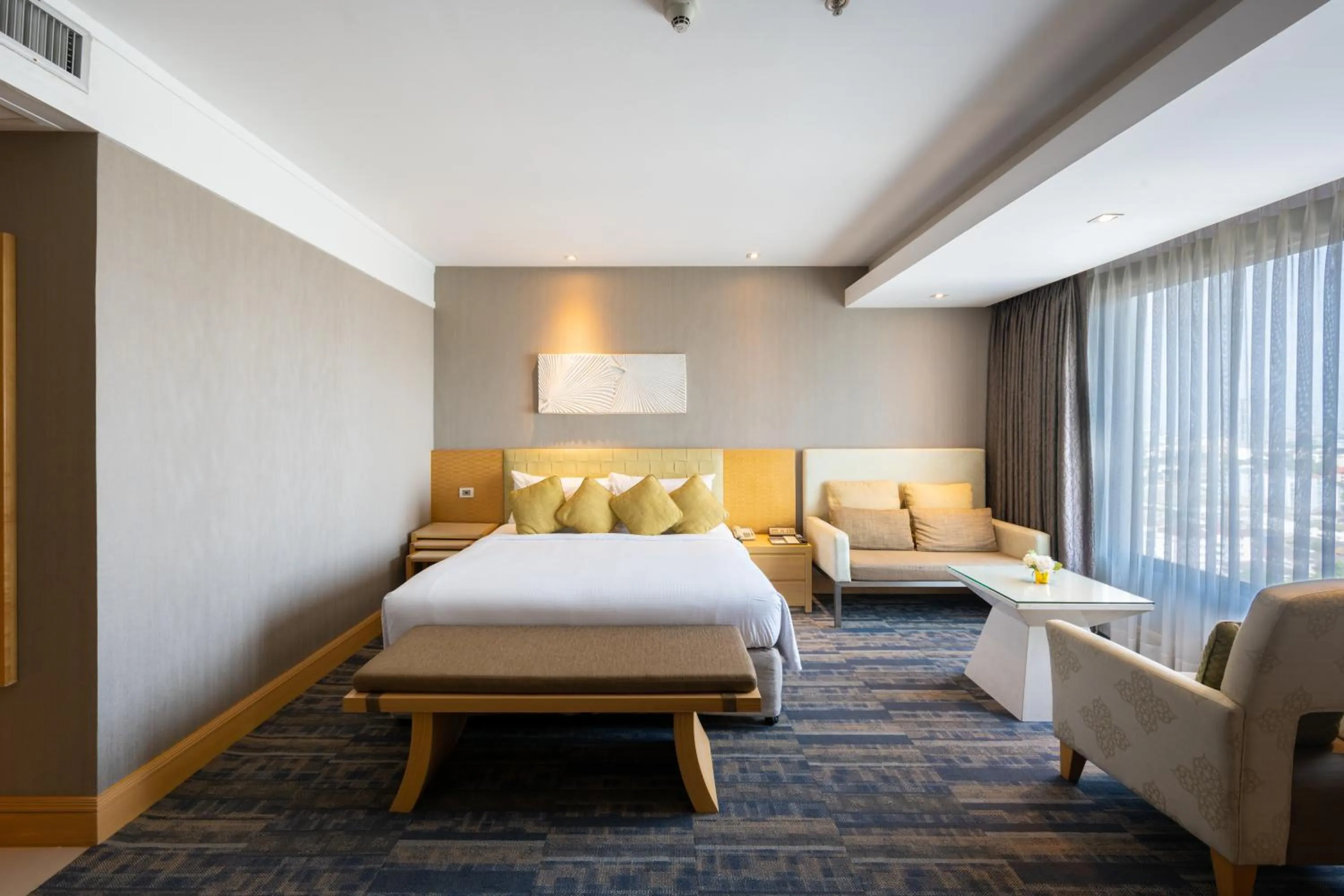 Bed in Grand Richmond Stylish Convention Hotel