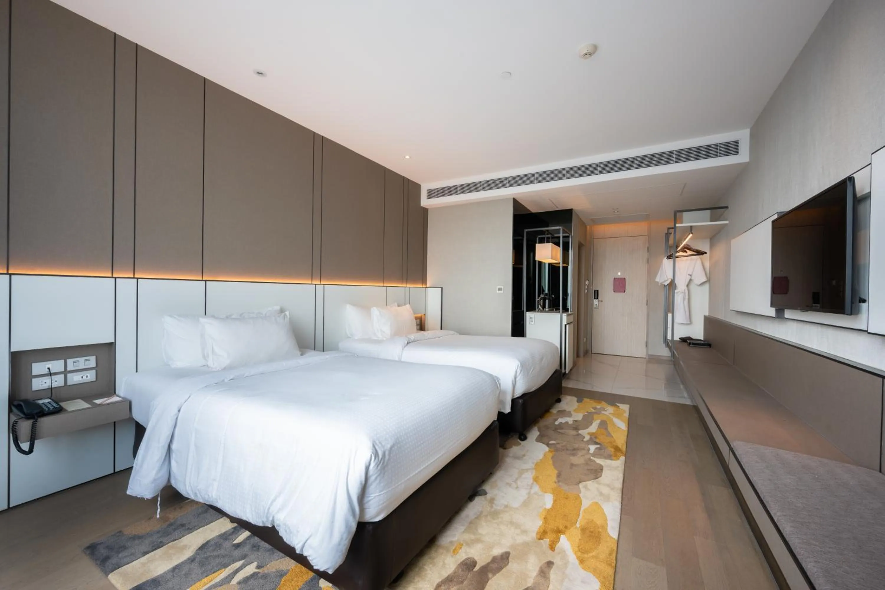 Bed in Grand Richmond Stylish Convention Hotel