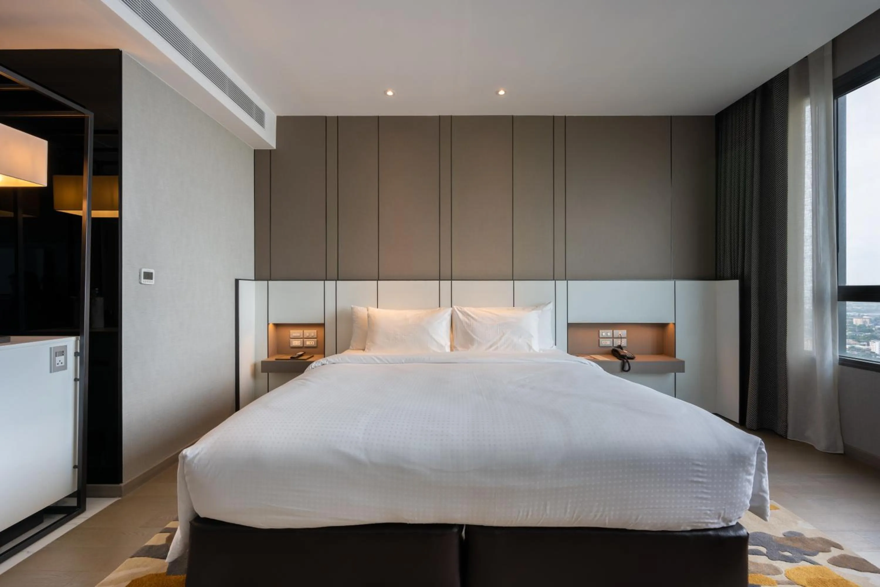 Bed in Grand Richmond Stylish Convention Hotel