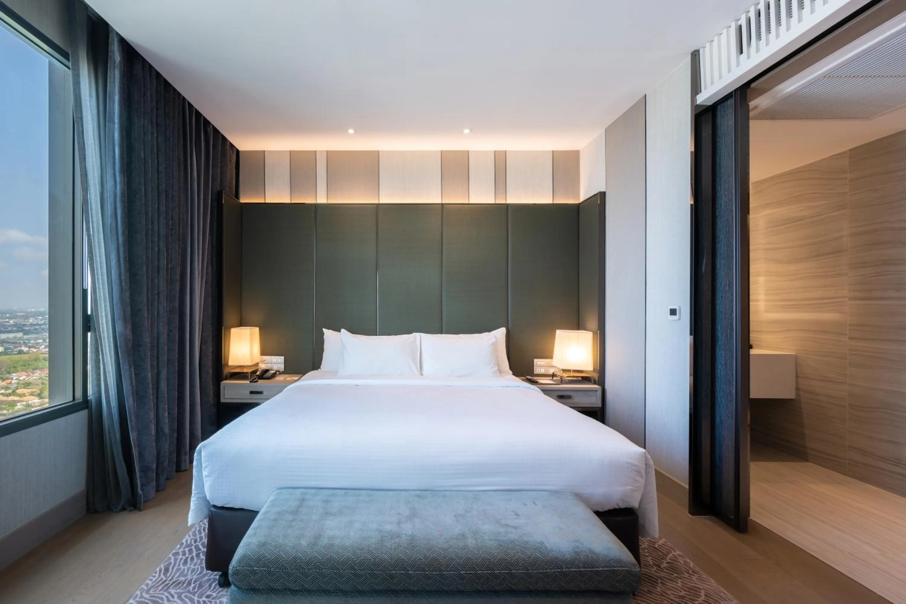 Bed in Grand Richmond Stylish Convention Hotel