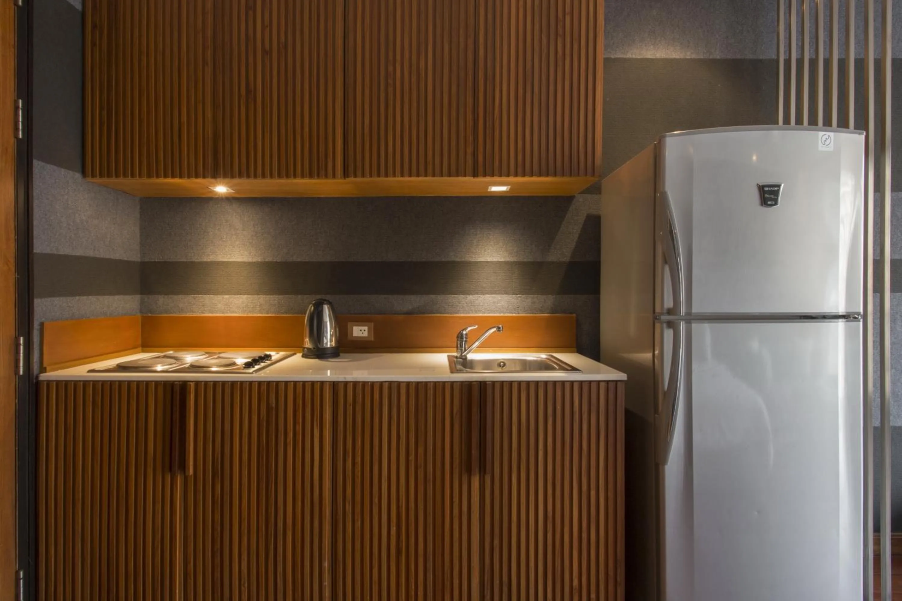 Kitchen or kitchenette in LUXX Langsuan Hotel - SHA Plus