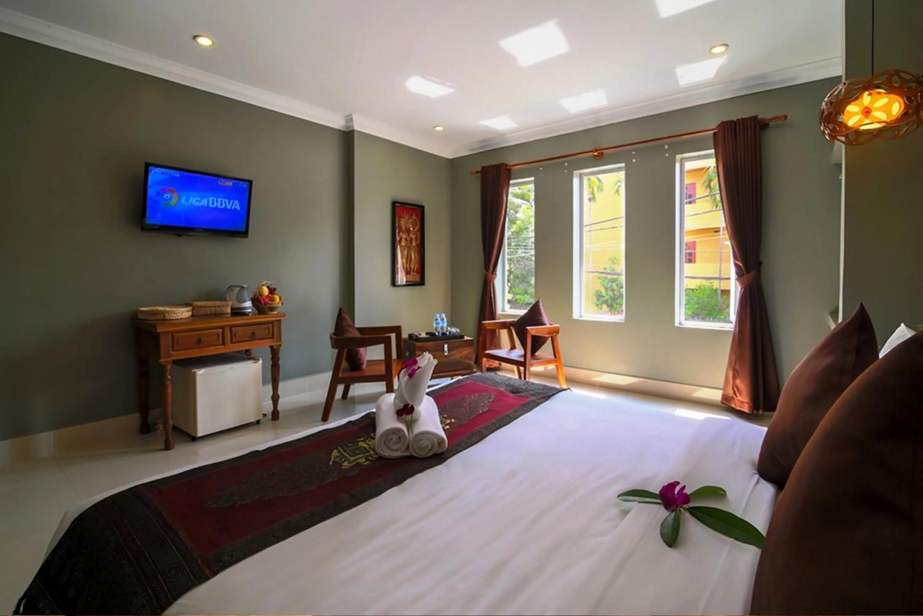 Bed in Plumeria Hotel & Spa