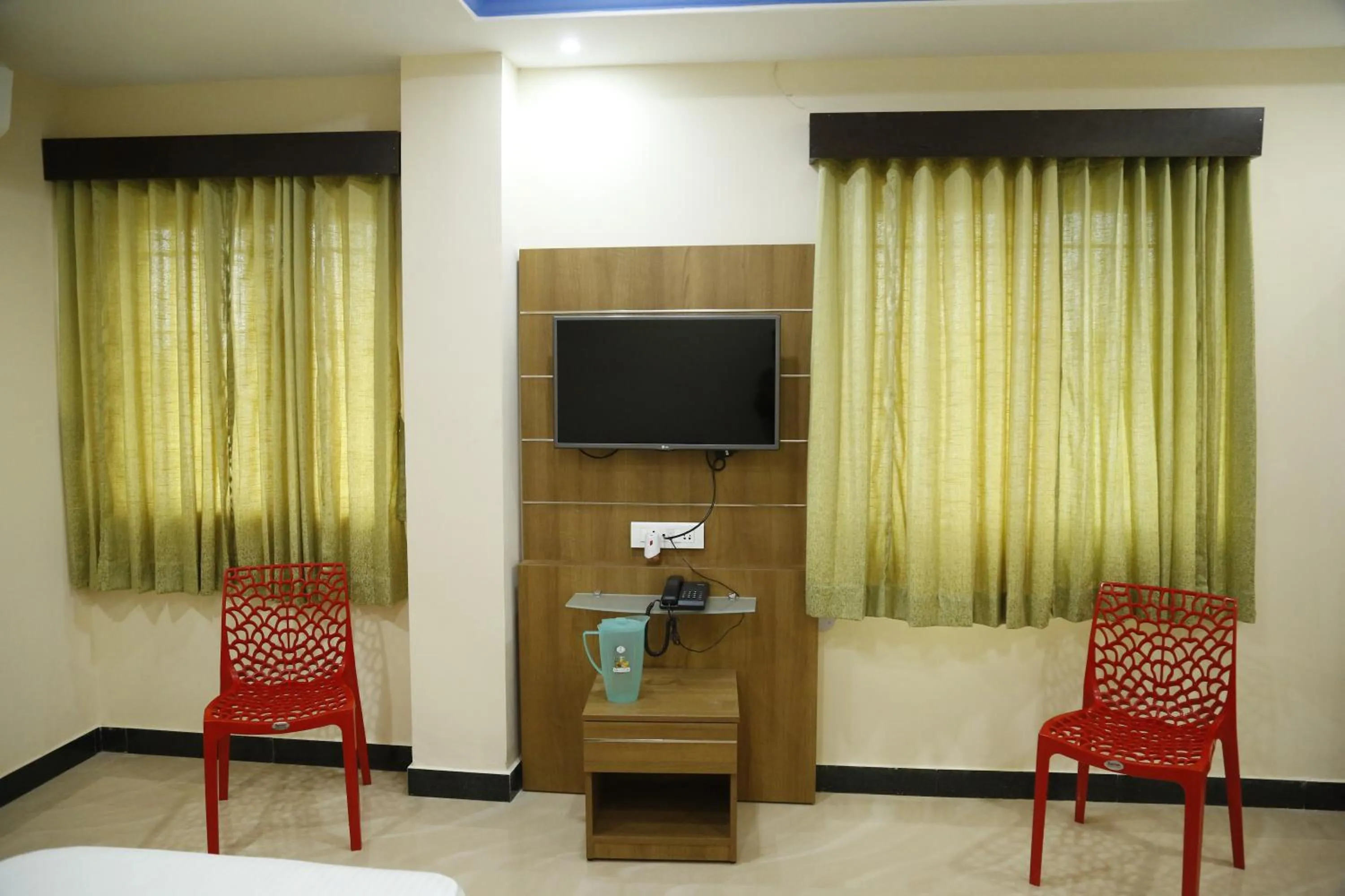 Bedroom in Hotel New Amirtham inn