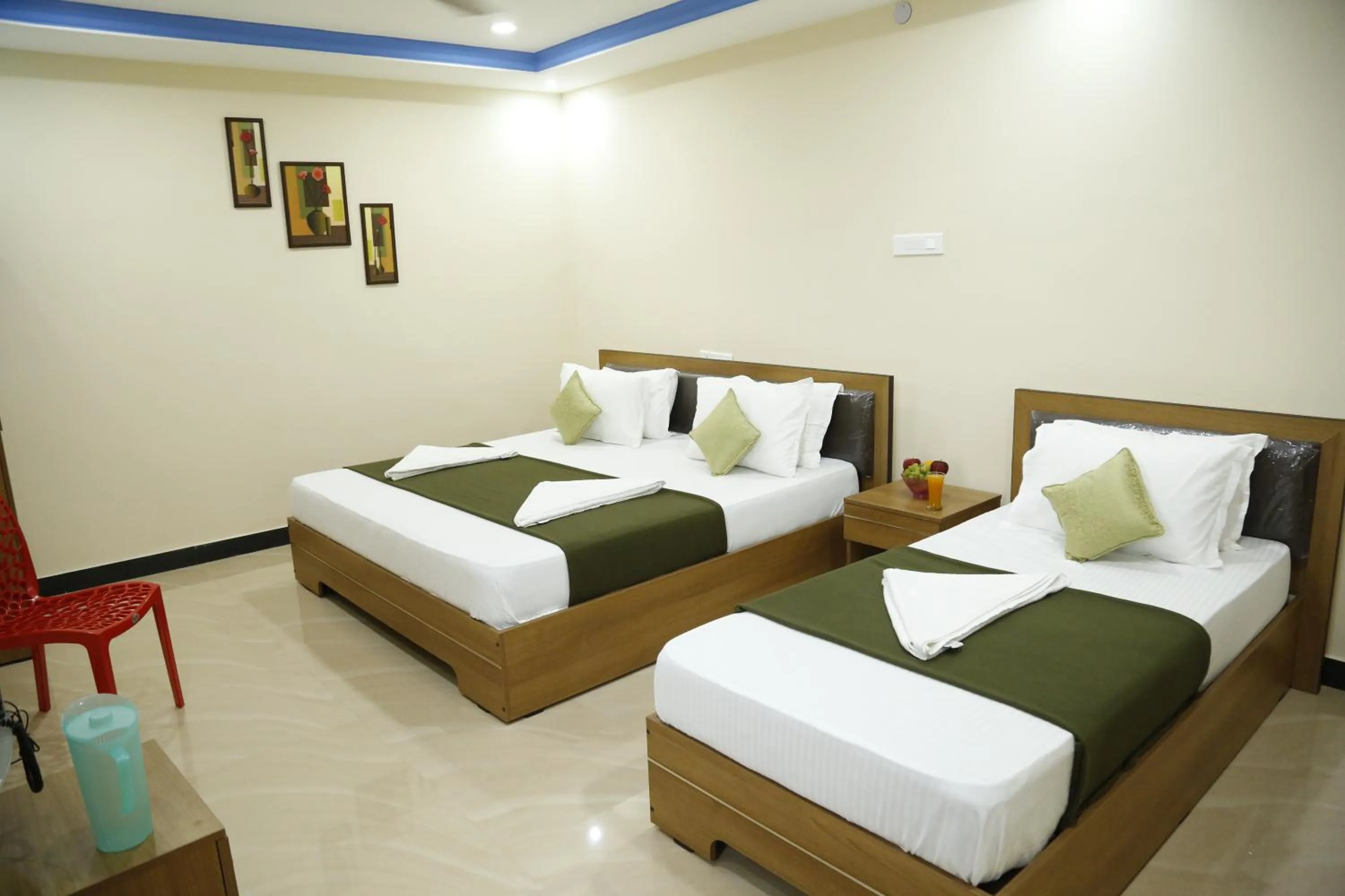 Bedroom in Hotel New Amirtham inn