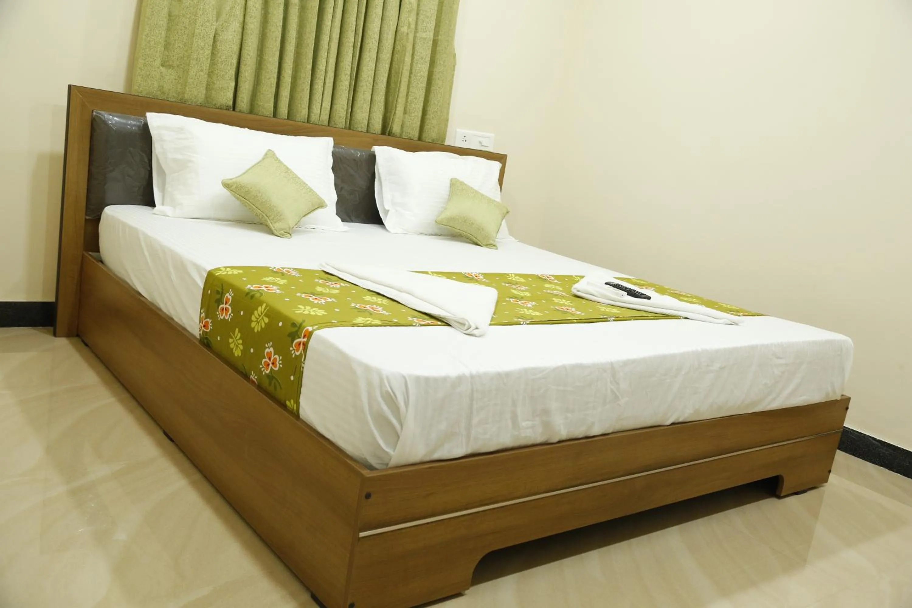 Bedroom in Hotel New Amirtham inn