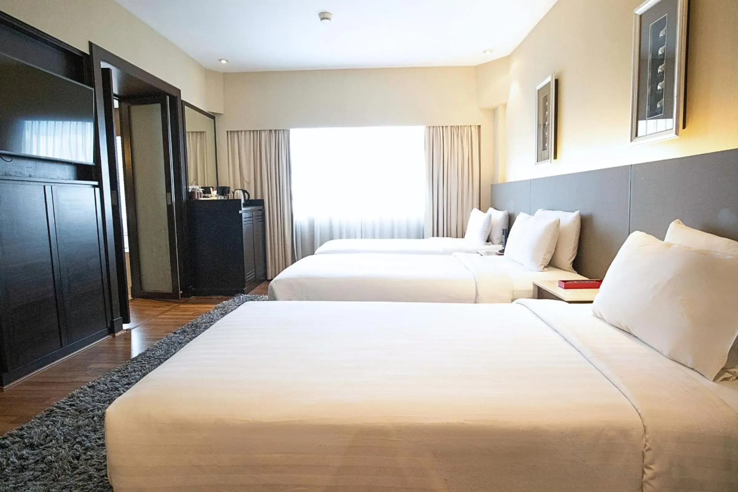 Triple Twin Room in Ramada Plaza by Wyndham Bangkok Menam Riverside Triple Twin Room in Ramada Plaza by Wyndham Bangkok Menam Riverside