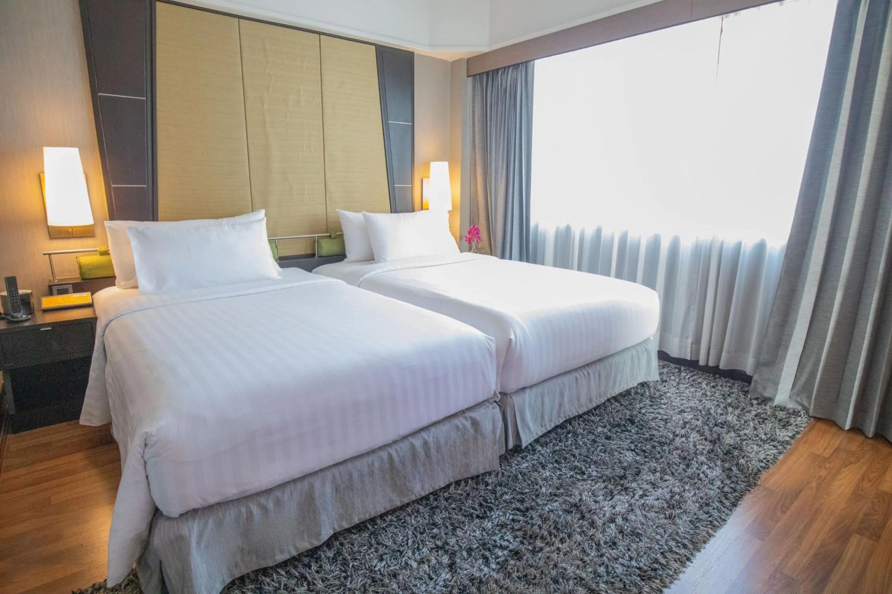 Bed in Ramada Plaza by Wyndham Bangkok Menam Riverside