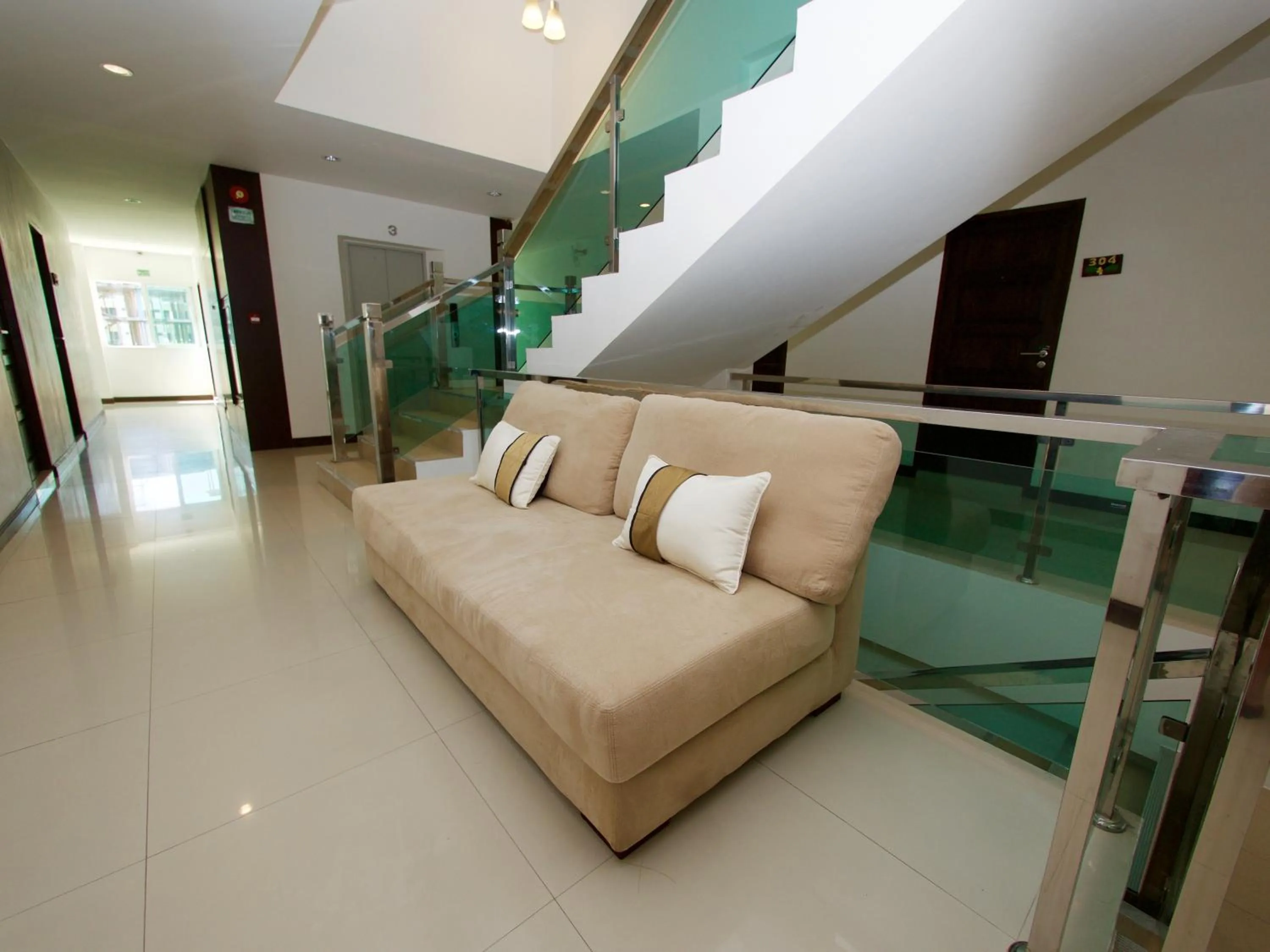 Seating area in Q Victory Patong Hotel