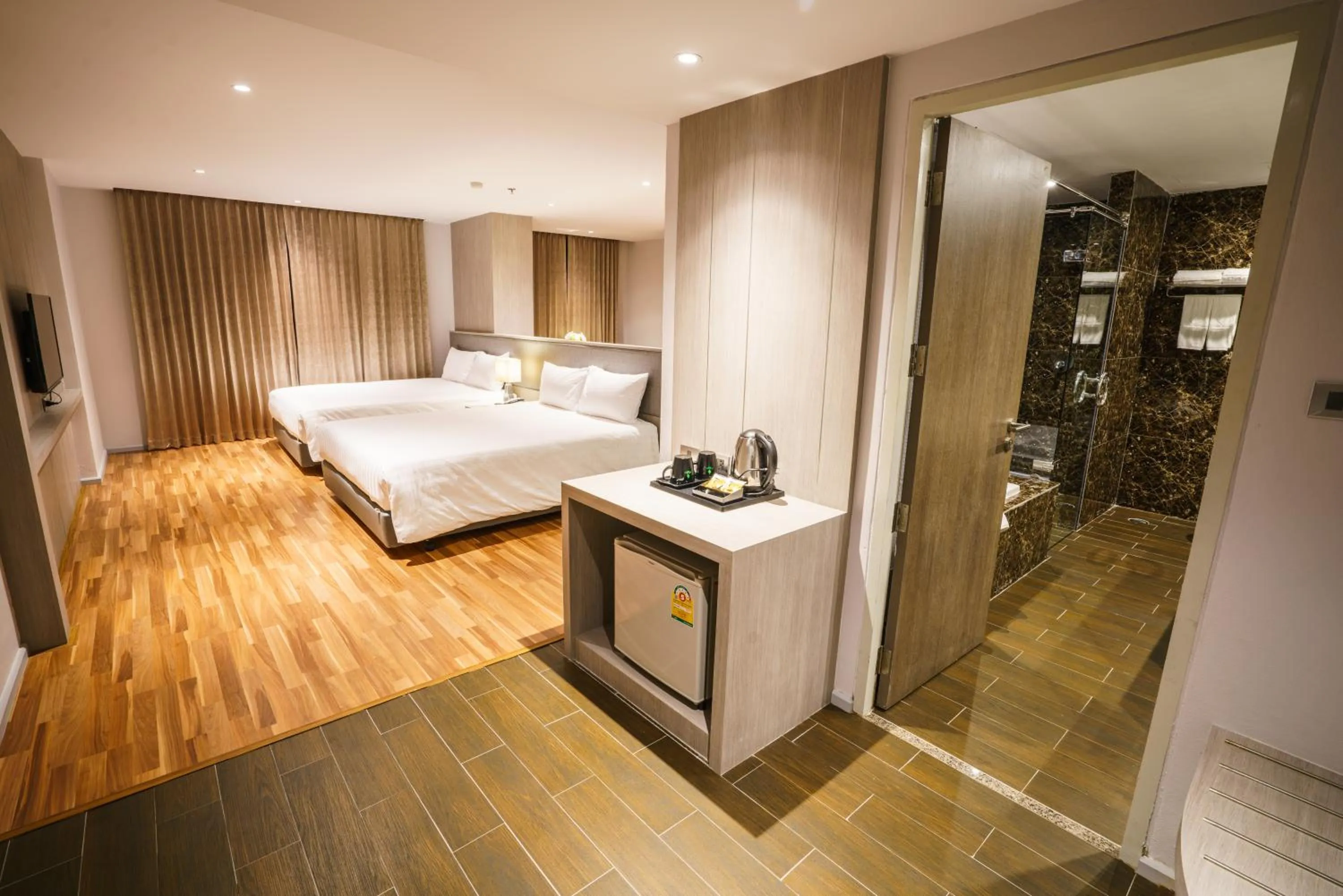 Bed in New Season Square Hotel