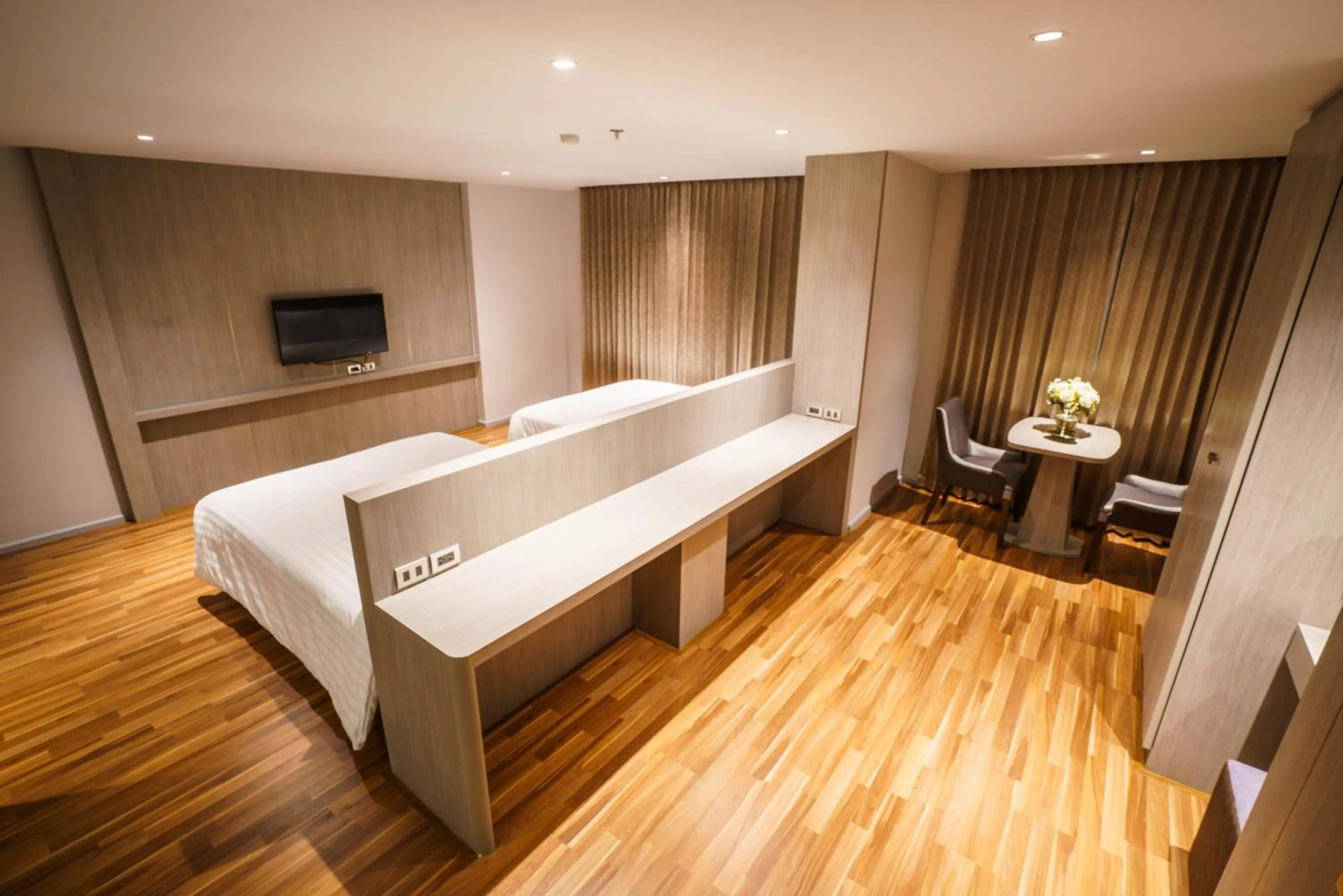 Bed in New Season Square Hotel