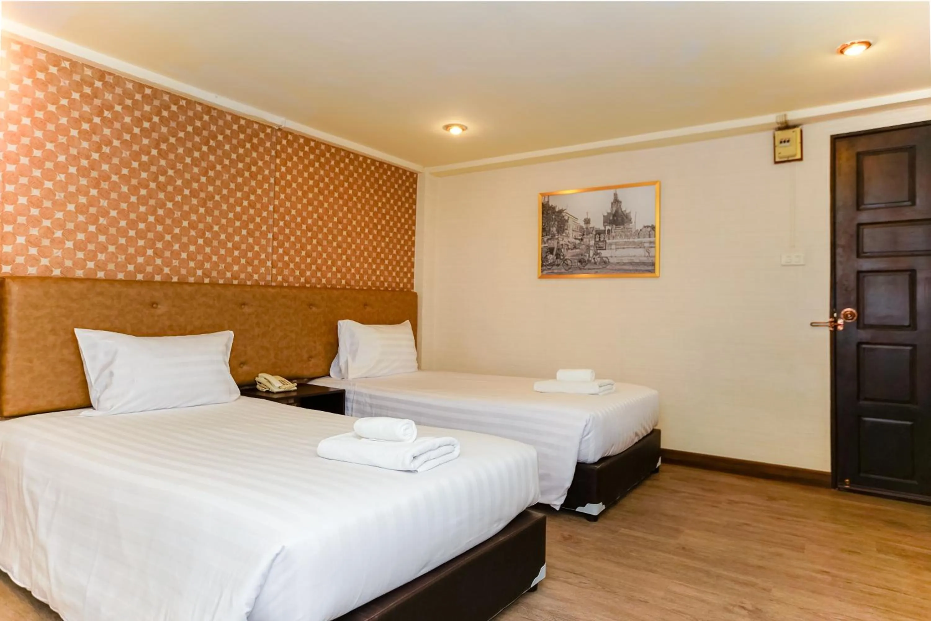 Bed in Parasol Inn Chiang Mai Old City