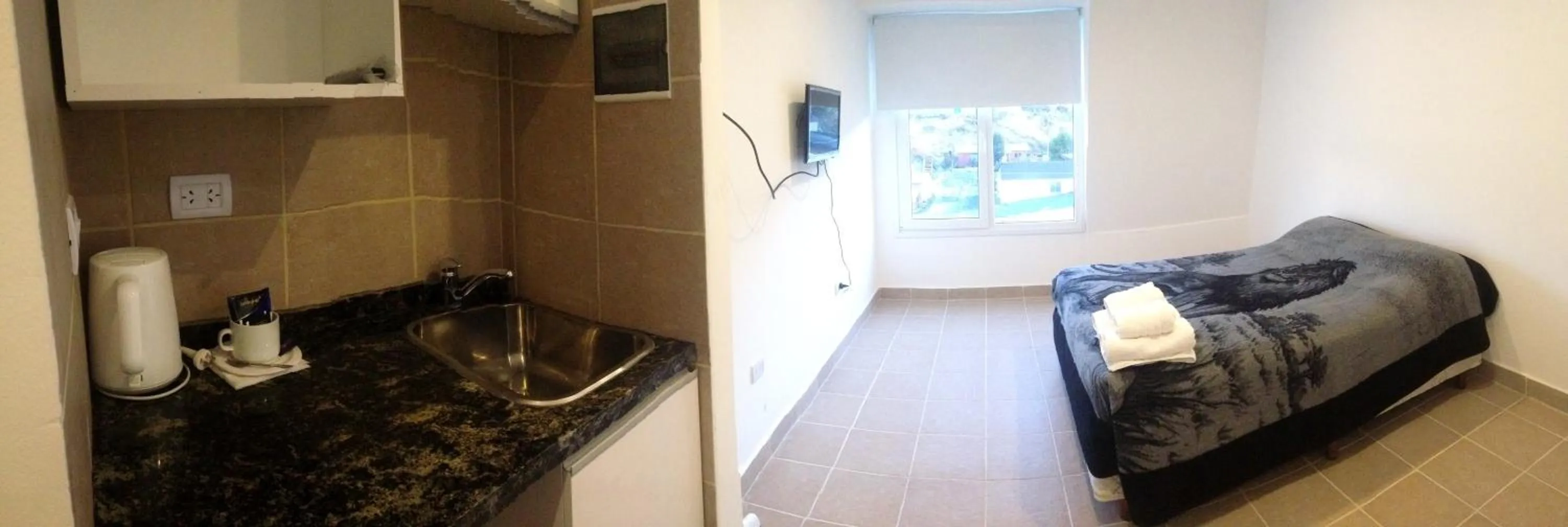 Photo of the whole room, Bed in Patagonia Austral Apartamentos