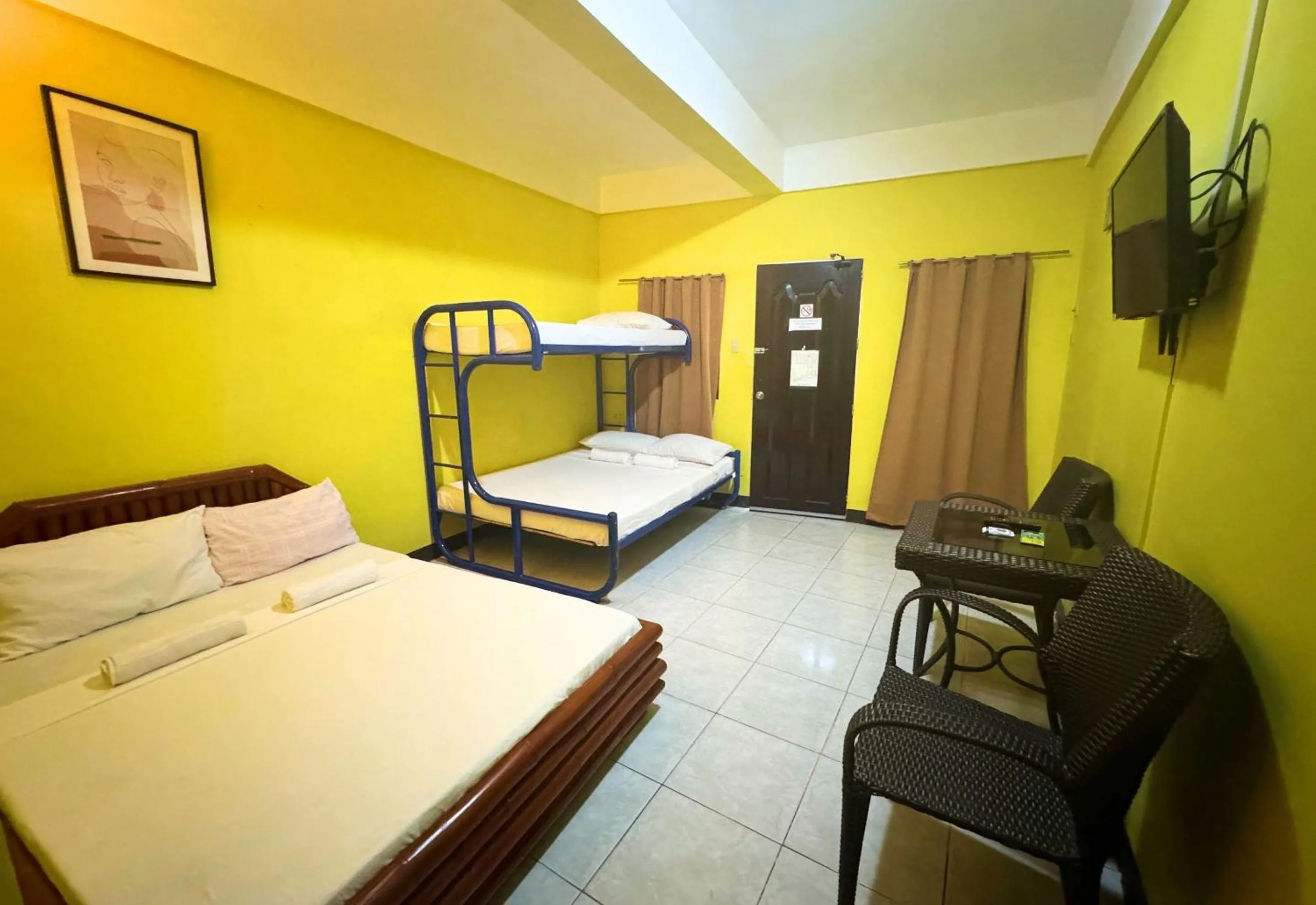 Bed in Simons Heritage Resort Puerto Galera