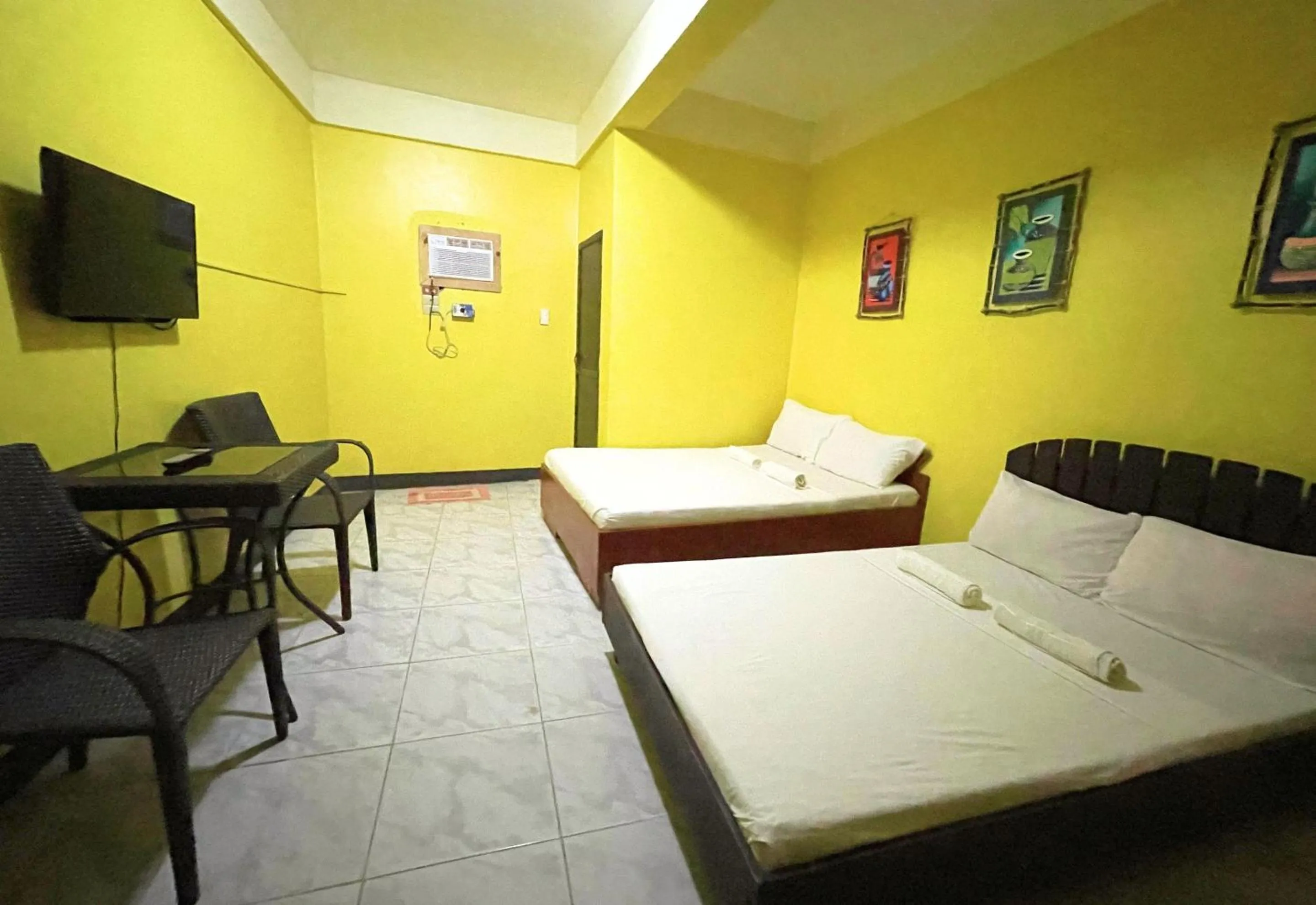 Bed in Simons Heritage Resort Puerto Galera