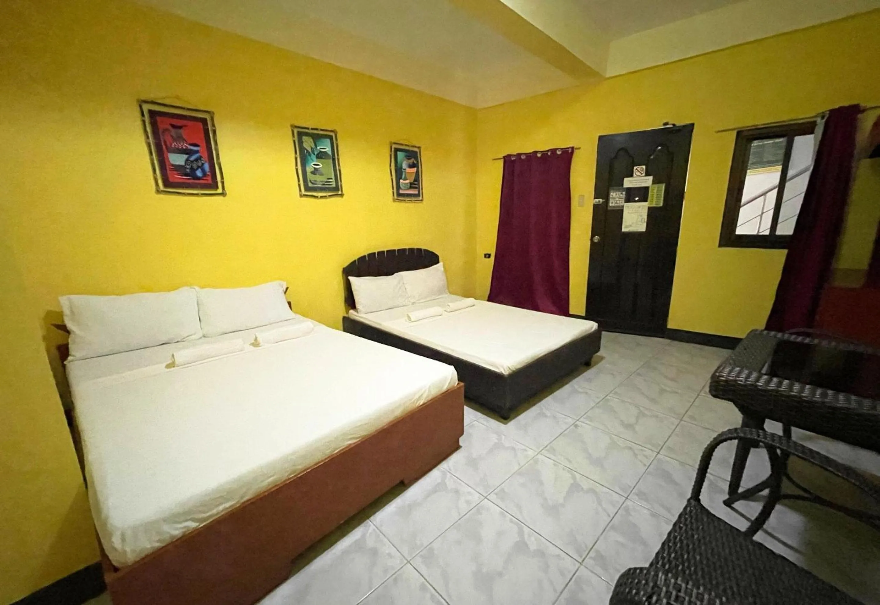 Bed in Simons Heritage Resort Puerto Galera