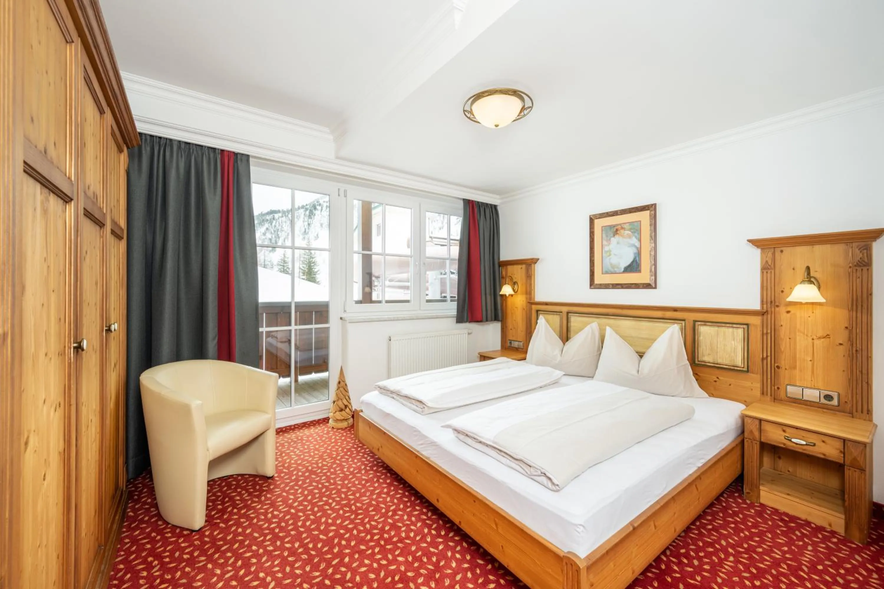 Photo of the whole room, Bed in Hotel Almschlössl & Schrotteralm