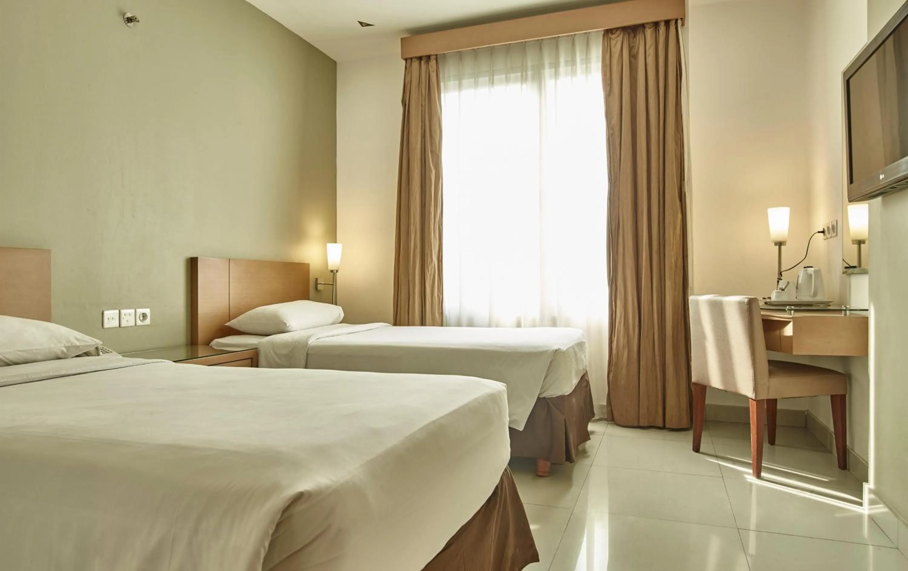 Bedroom, Bed in Triniti Hotel Gajah Mada